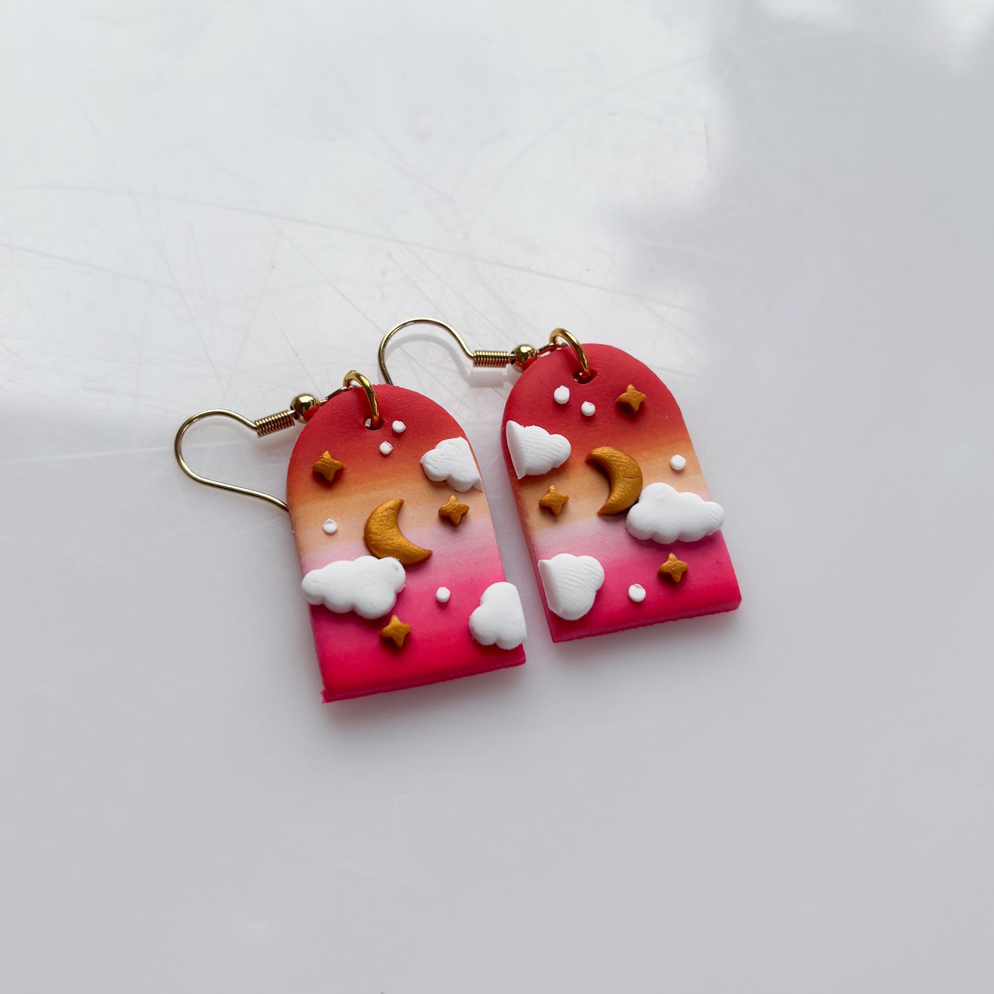 CLOUDY ARCH EARRINGS (LESBIAN FLAG)