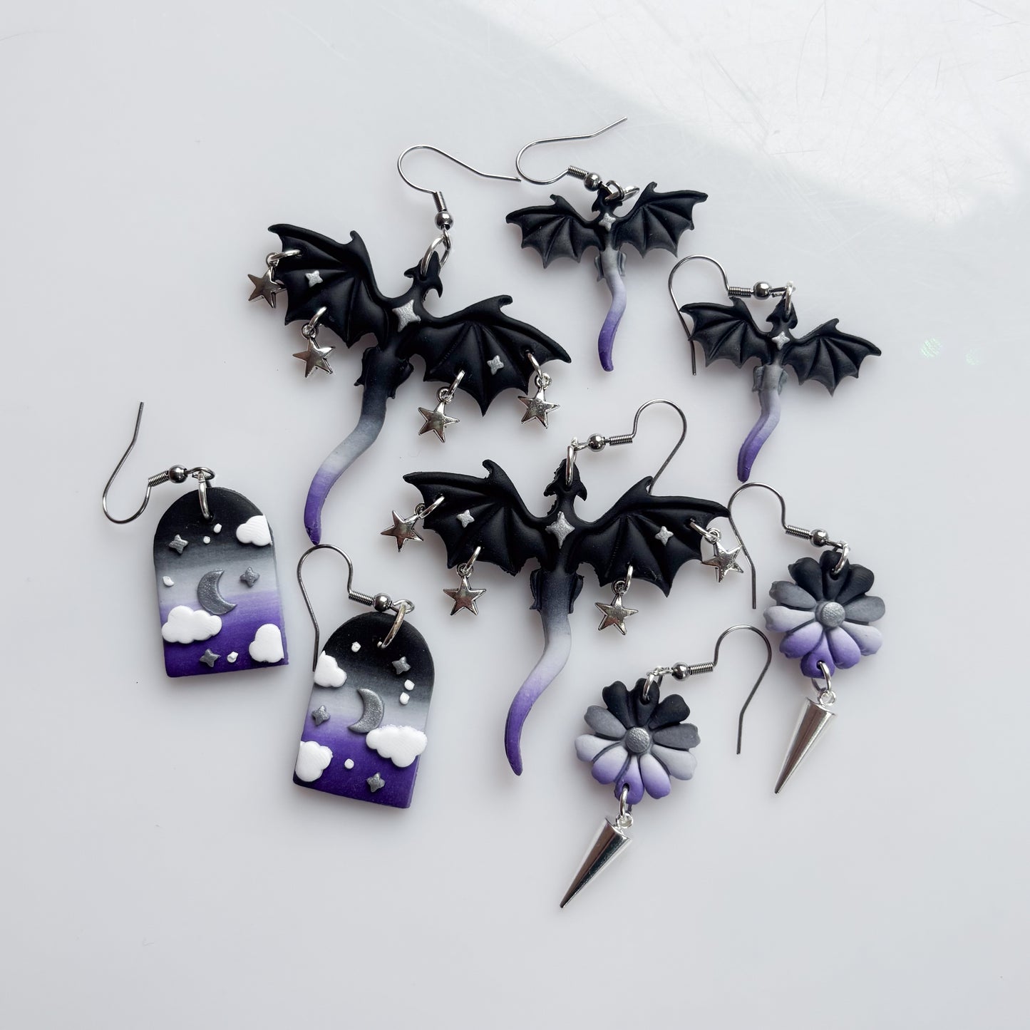 DRAGON EARRINGS (ACE FLAG)