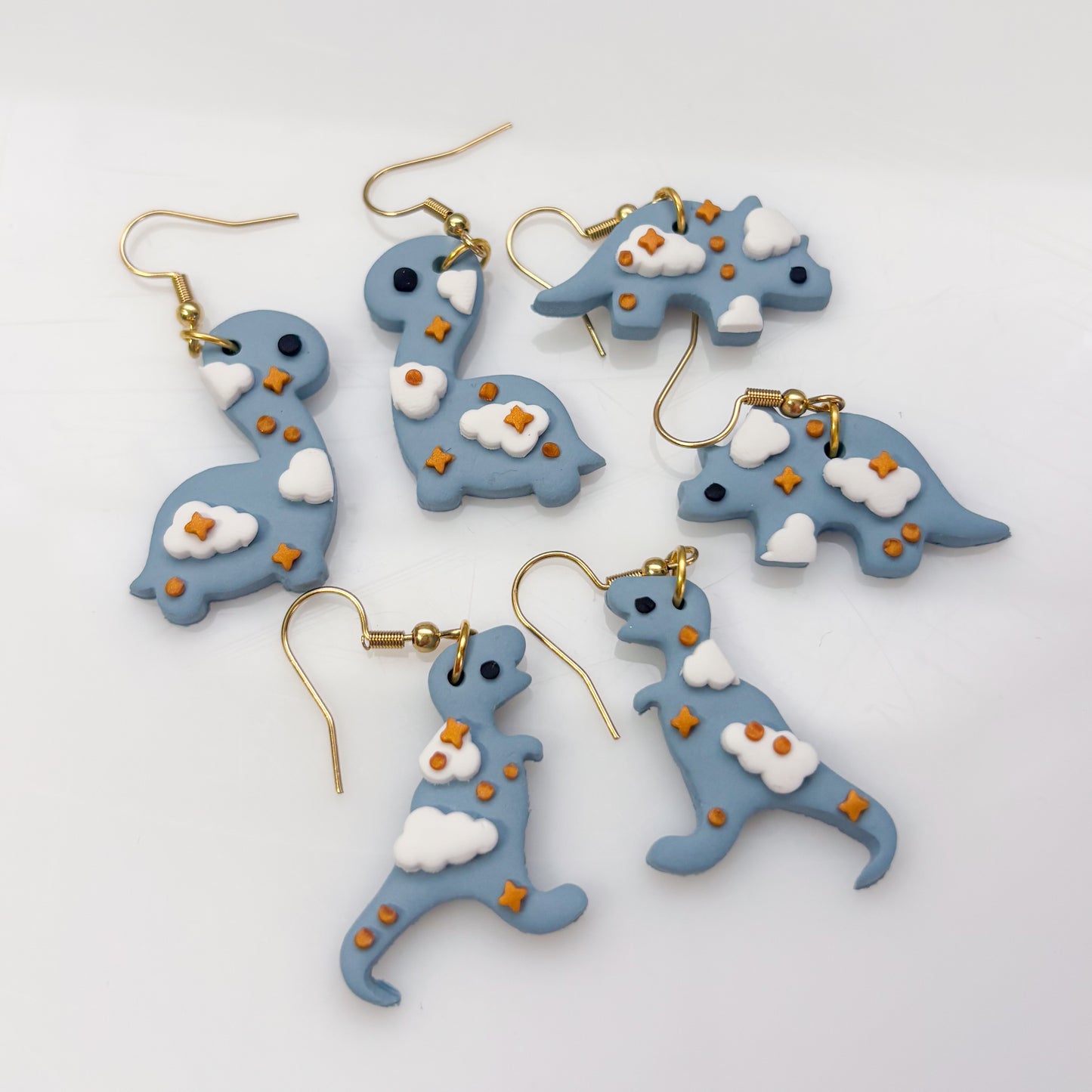 CLOUDY DINO EARRINGS (TRICERATOPS)