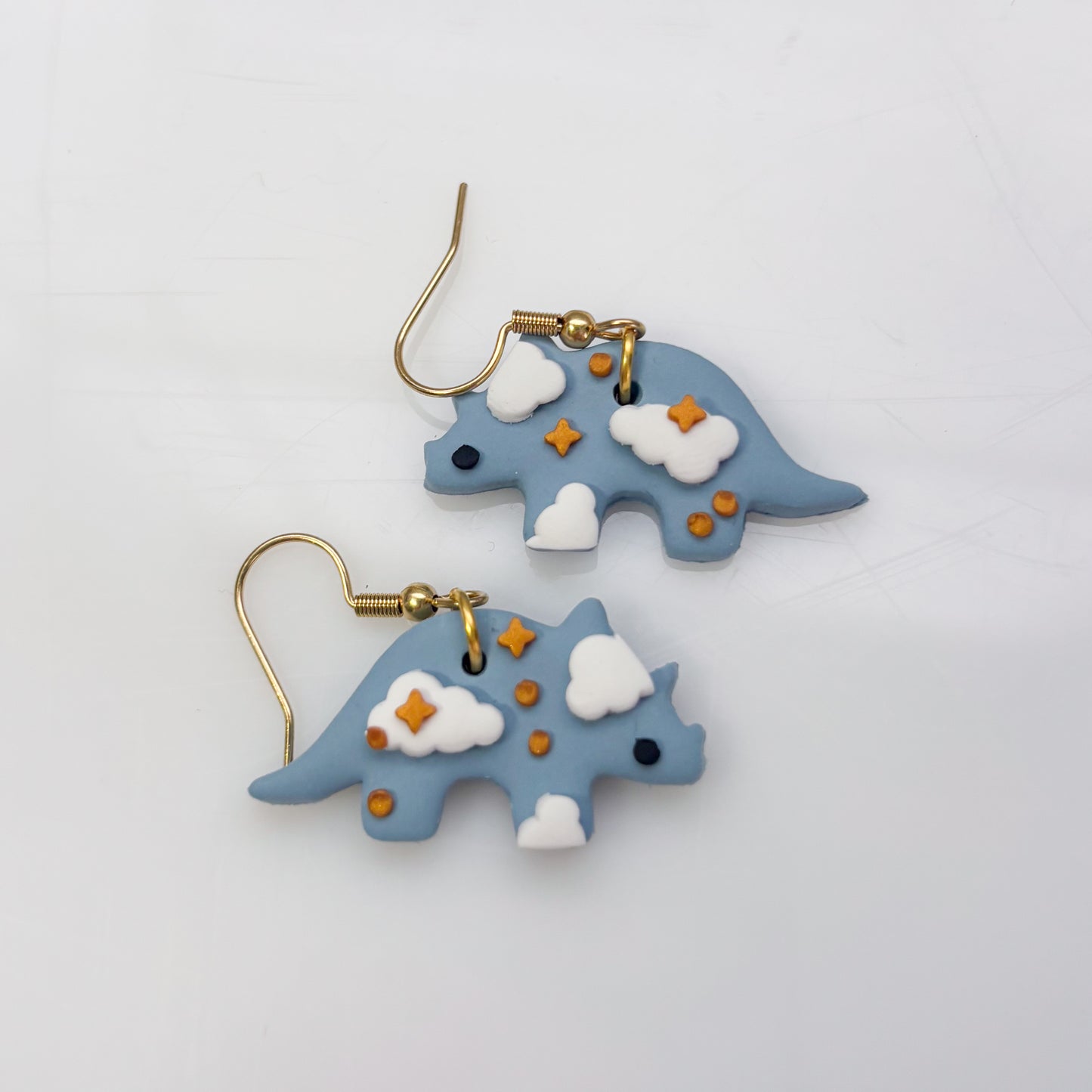 CLOUDY DINO EARRINGS (TRICERATOPS)