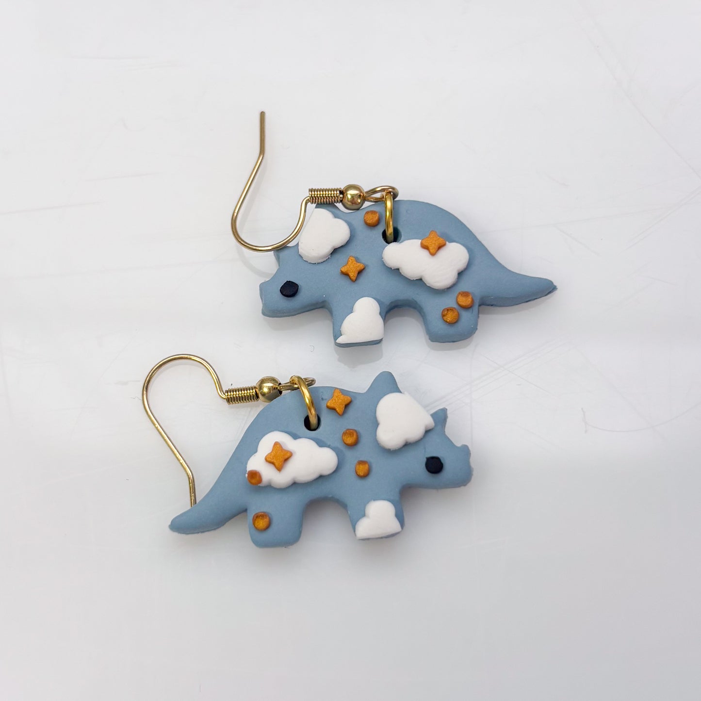 CLOUDY DINO EARRINGS (TRICERATOPS)