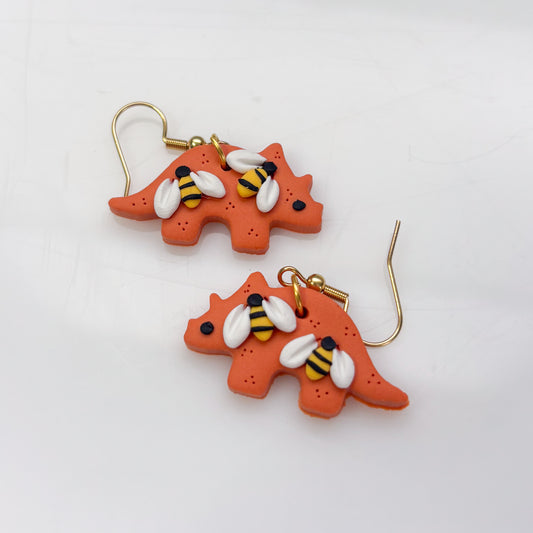 ORANGE BEE DINO EARRINGS (TRICERATOPS)