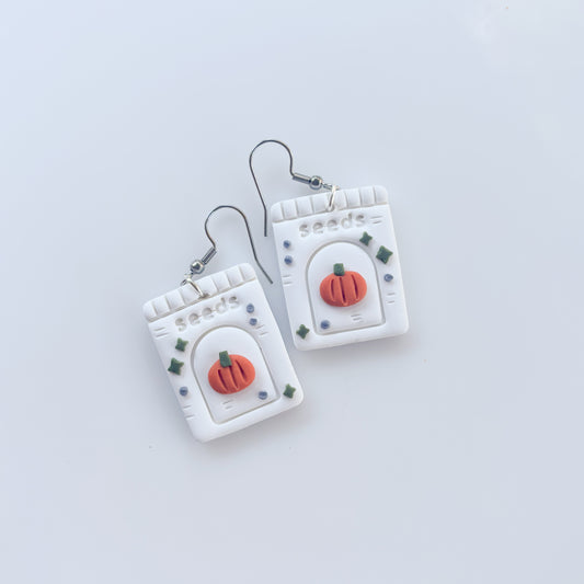PUMPKIN SEED PACKET EARRINGS