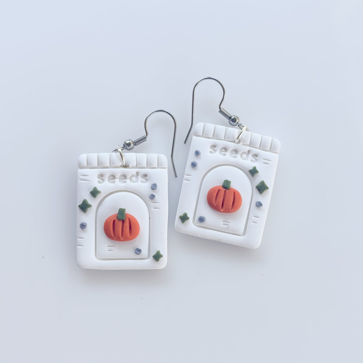PUMPKIN SEED PACKET EARRINGS