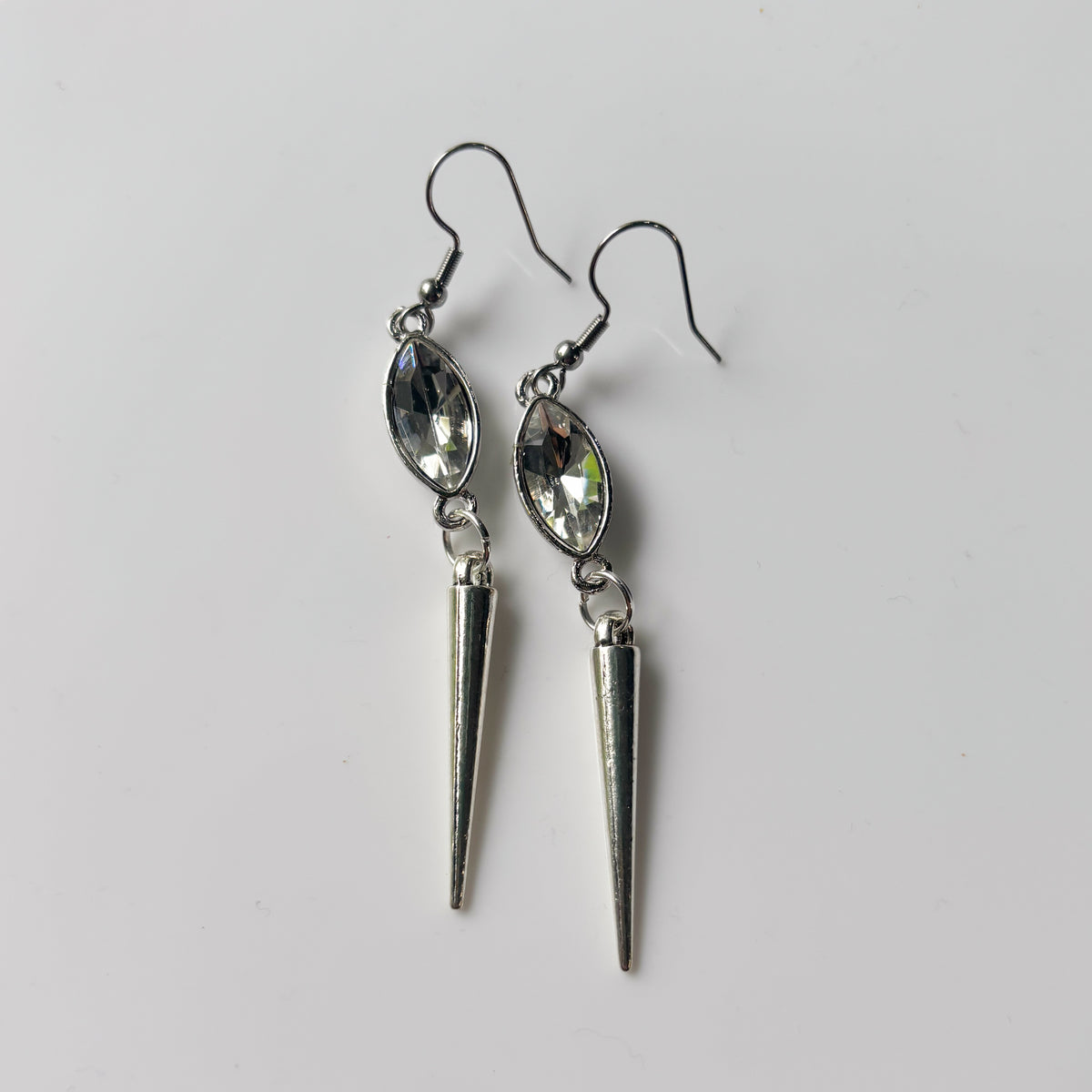 CLEAR OVAL SILVER SPIKE CHARM EARRINGS