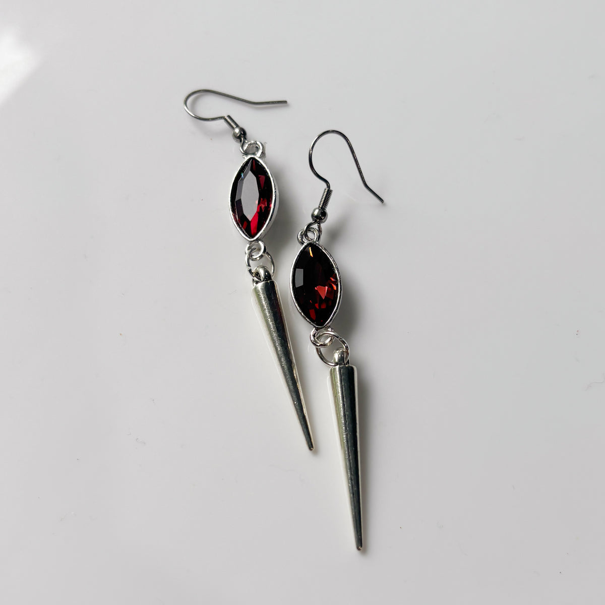 DEEP RED OVAL SILVER SPIKE CHARM EARRINGS