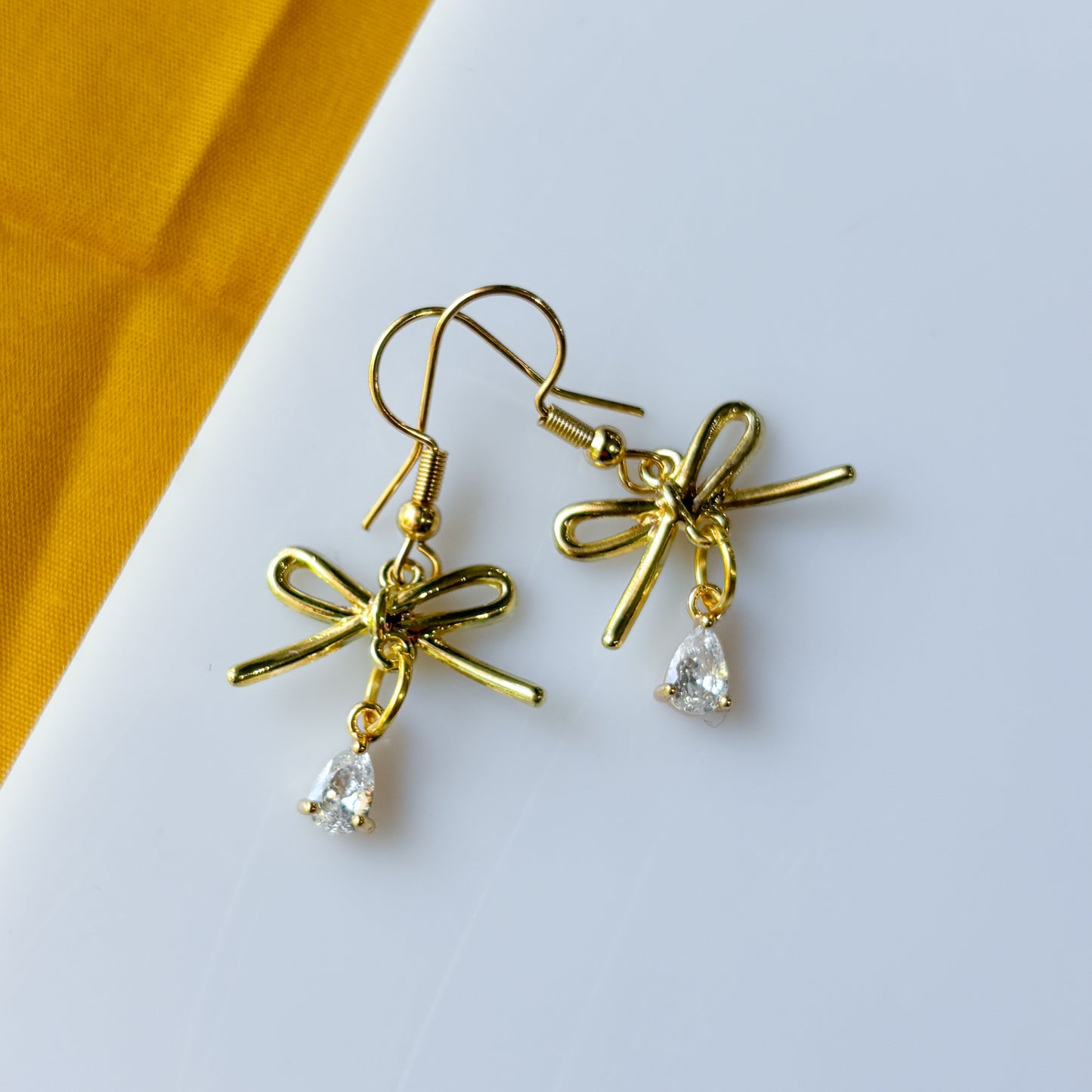 GOLD BOW & CRYSTAL TEARDROP CHARM EARRINGS