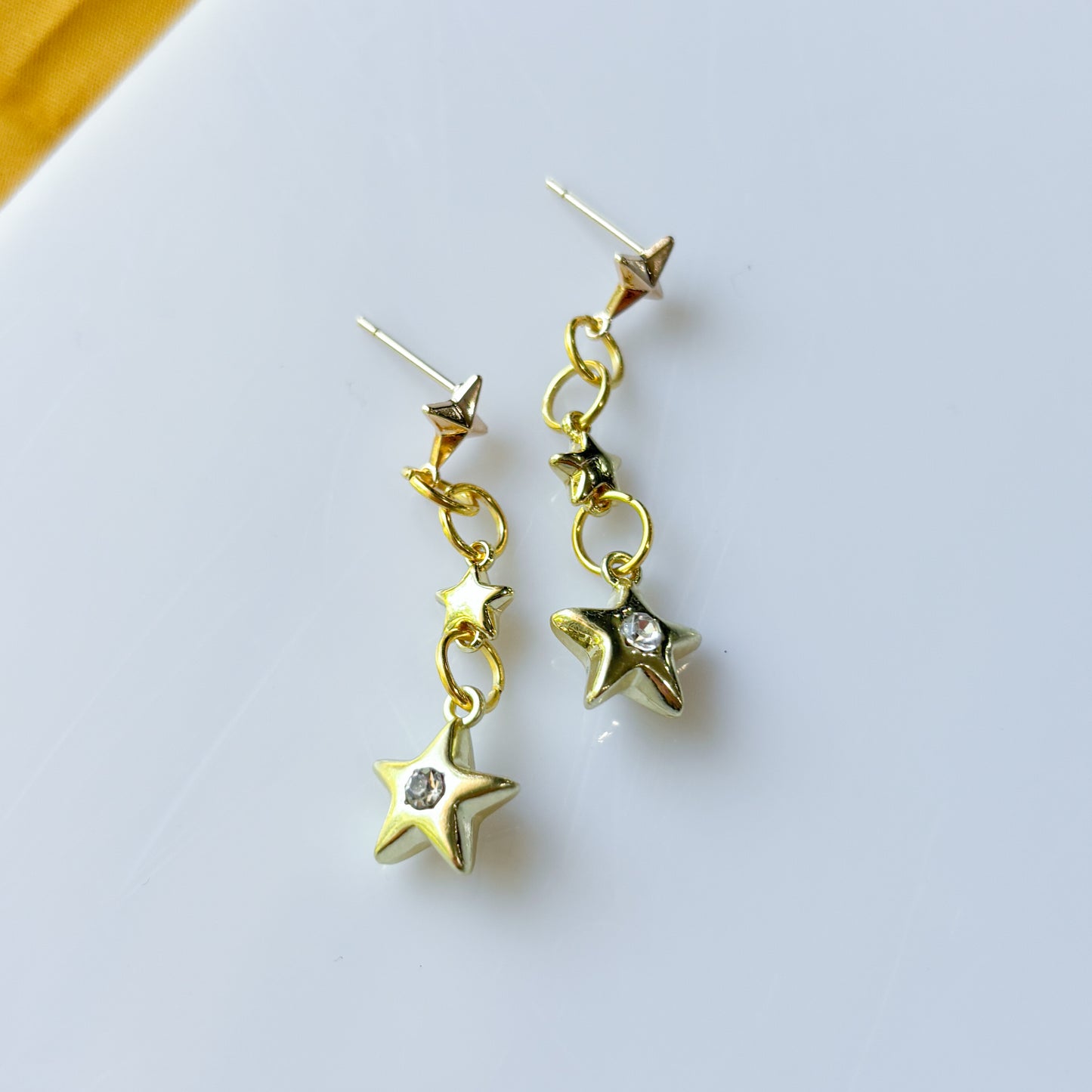 TRIPLE STAR STUD CHARM EARRINGS