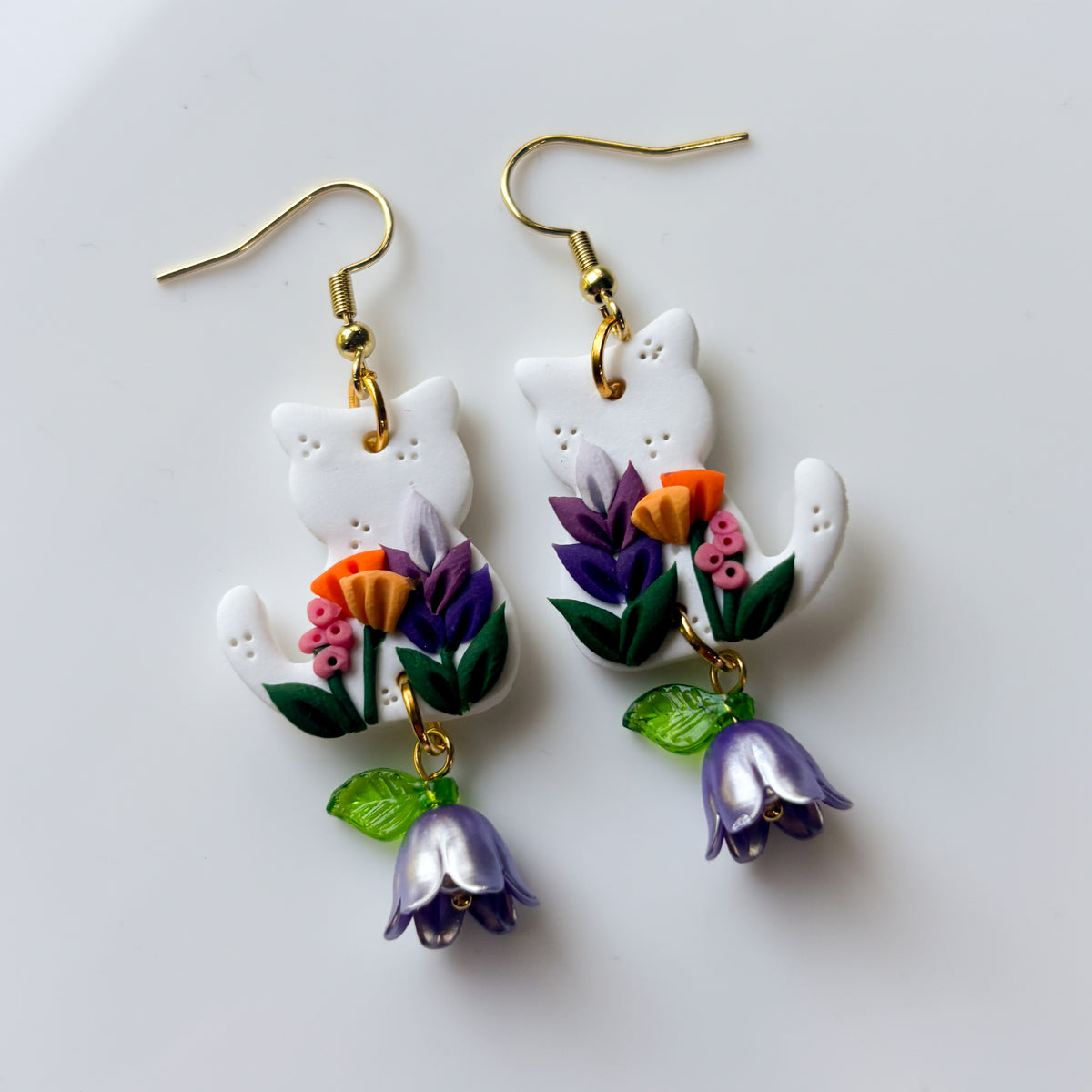 WHITE FLORAL CAT EARRINGS