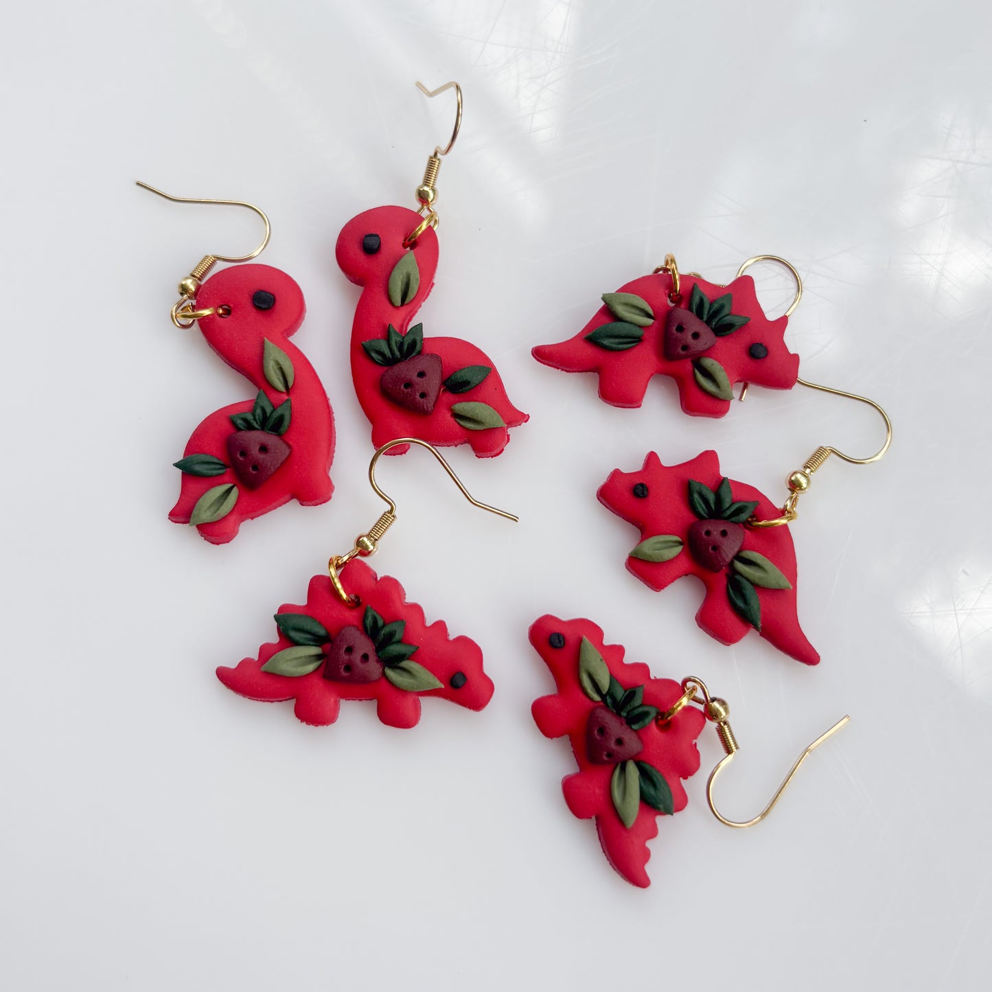 RED STRAWBERRY DINO EARRINGS (STEGO)