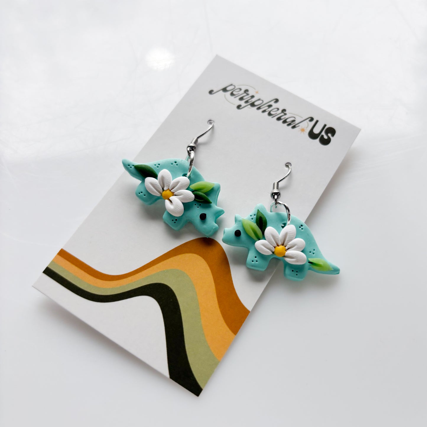 DAISY TEAL TRICERATOPS DINO EARRINGS