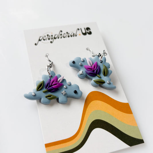 DUSTY BLUE LAVENDER STEGO DINO EARRINGS