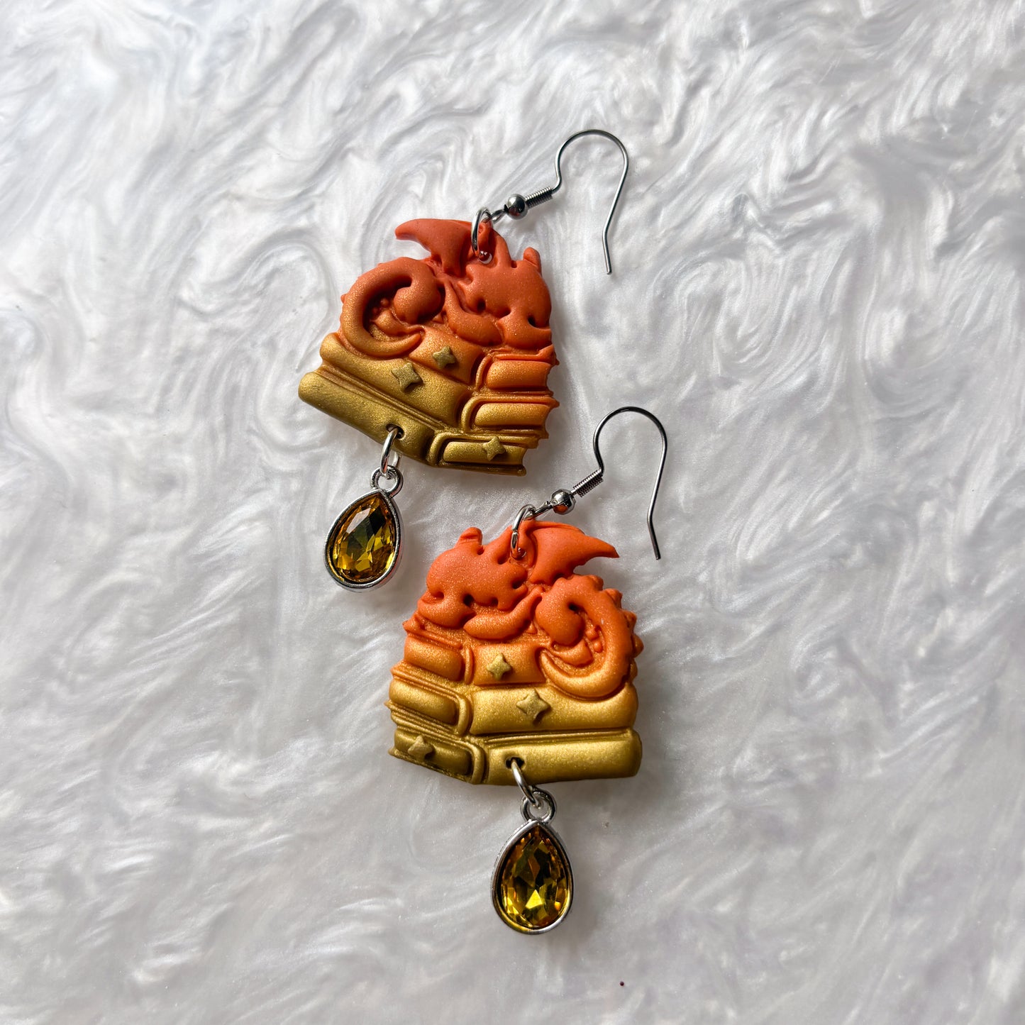 ORANGE DRAGONS ON BOOKS EARRINGS