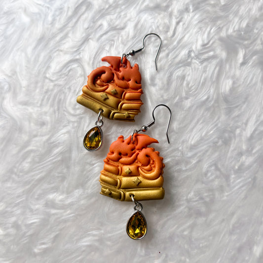 ORANGE DRAGONS ON BOOKS EARRINGS