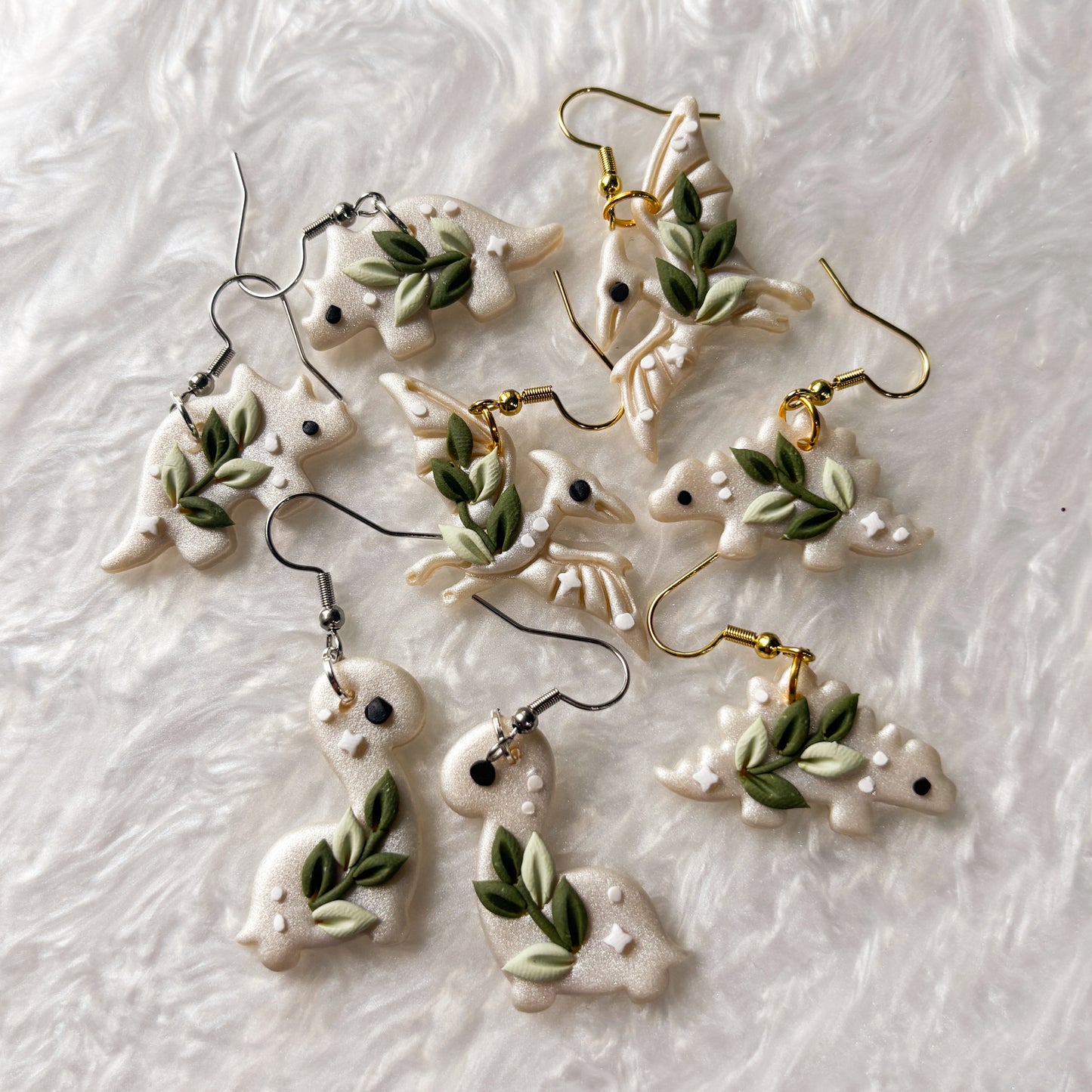 CELESTIAL VINE DINO EARRINGS (TRICERATOPS)