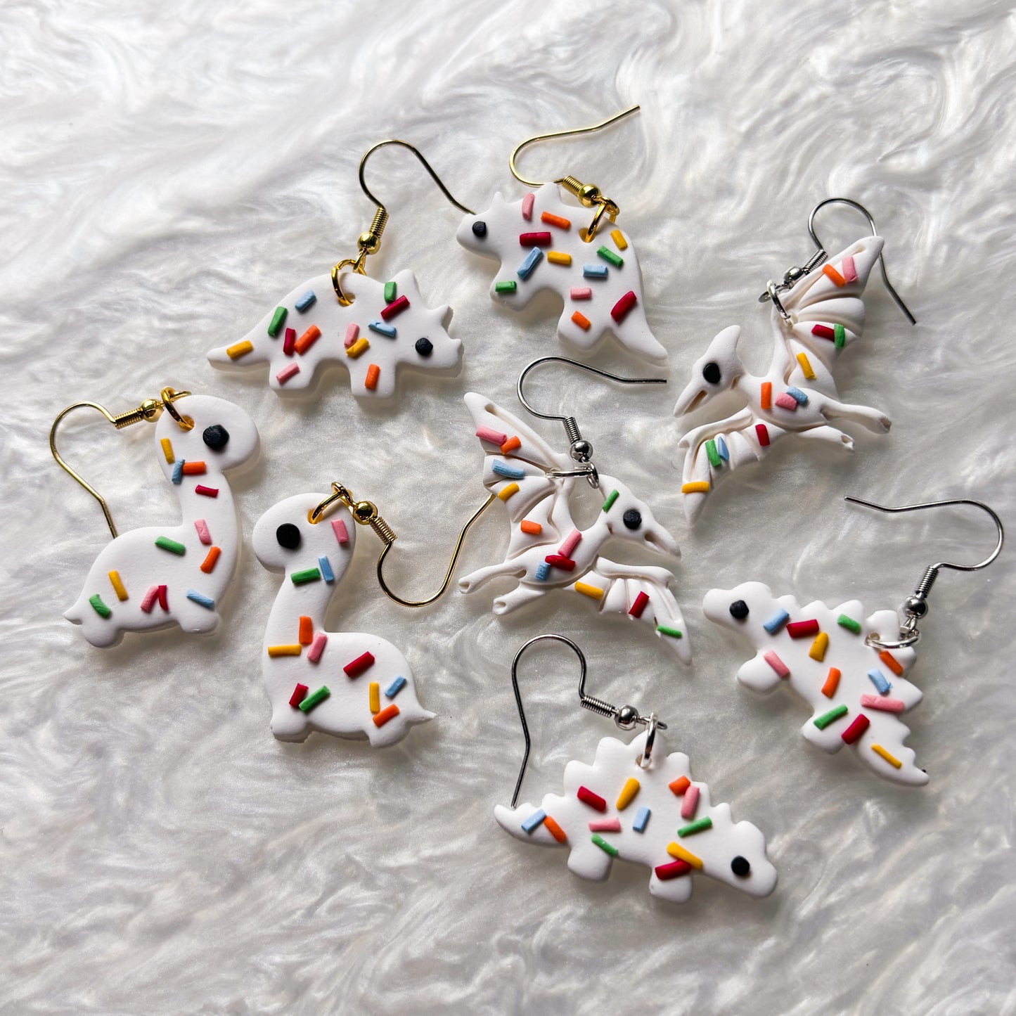 RAINBOW SPRINKLE DINO EARRINGS (PTERODACTYL)