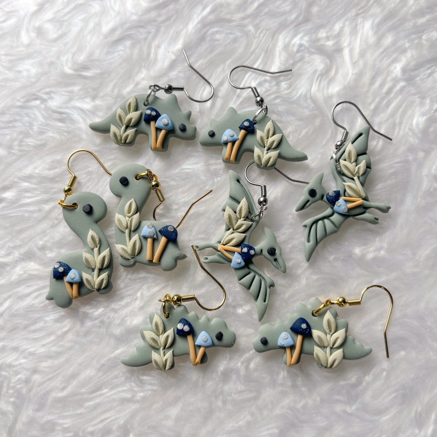 BLUE MUSHROOM DINO EARRINGS (STEGOSAURUS)