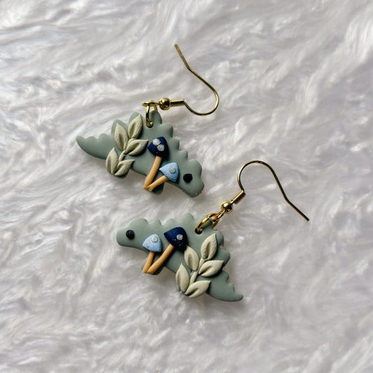 BLUE MUSHROOM DINO EARRINGS (STEGOSAURUS)