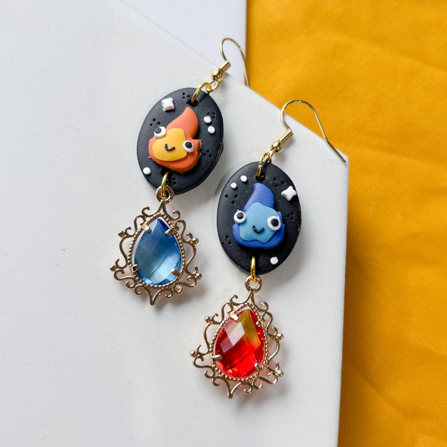 MISMATCHED FLAME SPIRIT OVAL EARRINGS