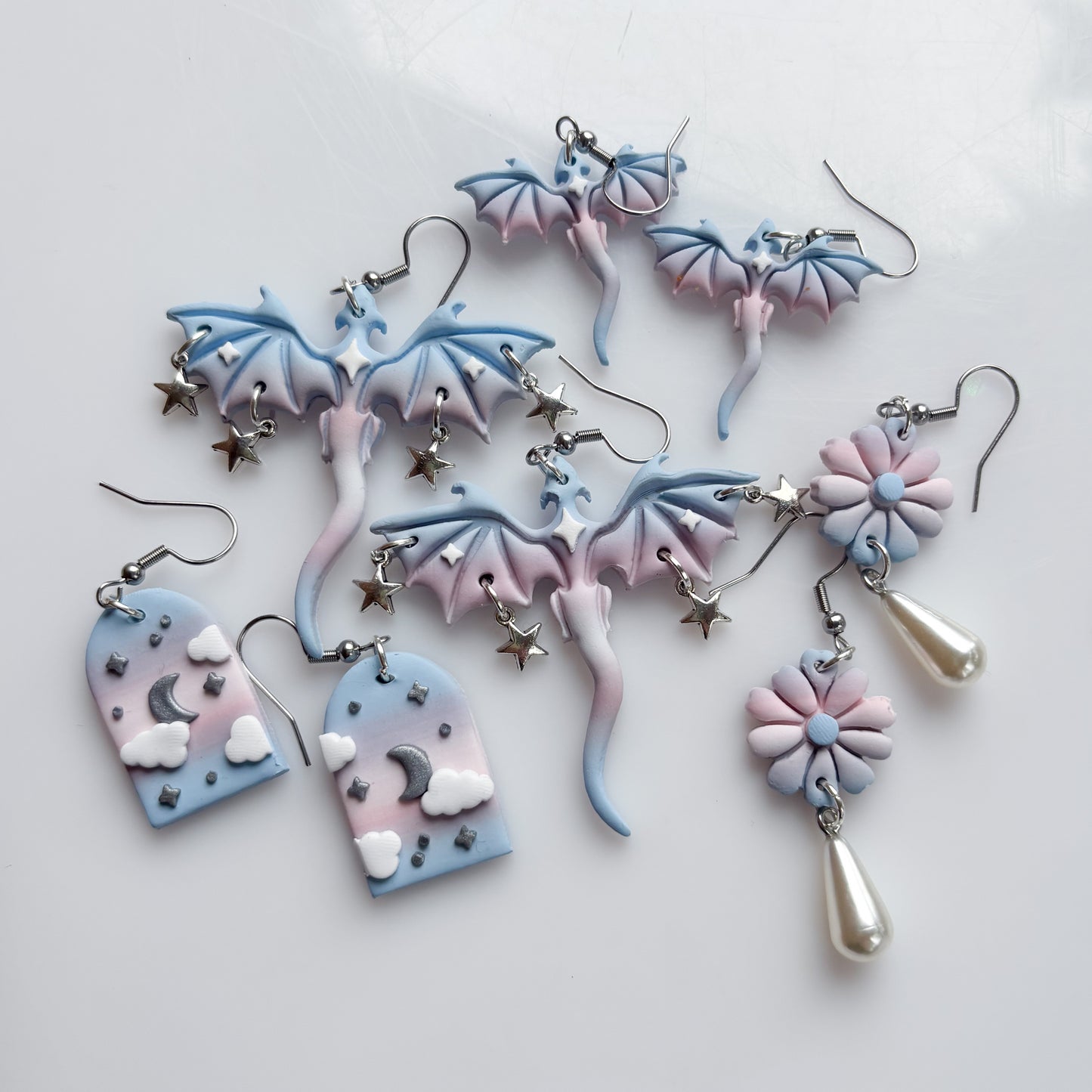 MINI DRAGON EARRINGS (TRANS FLAG)
