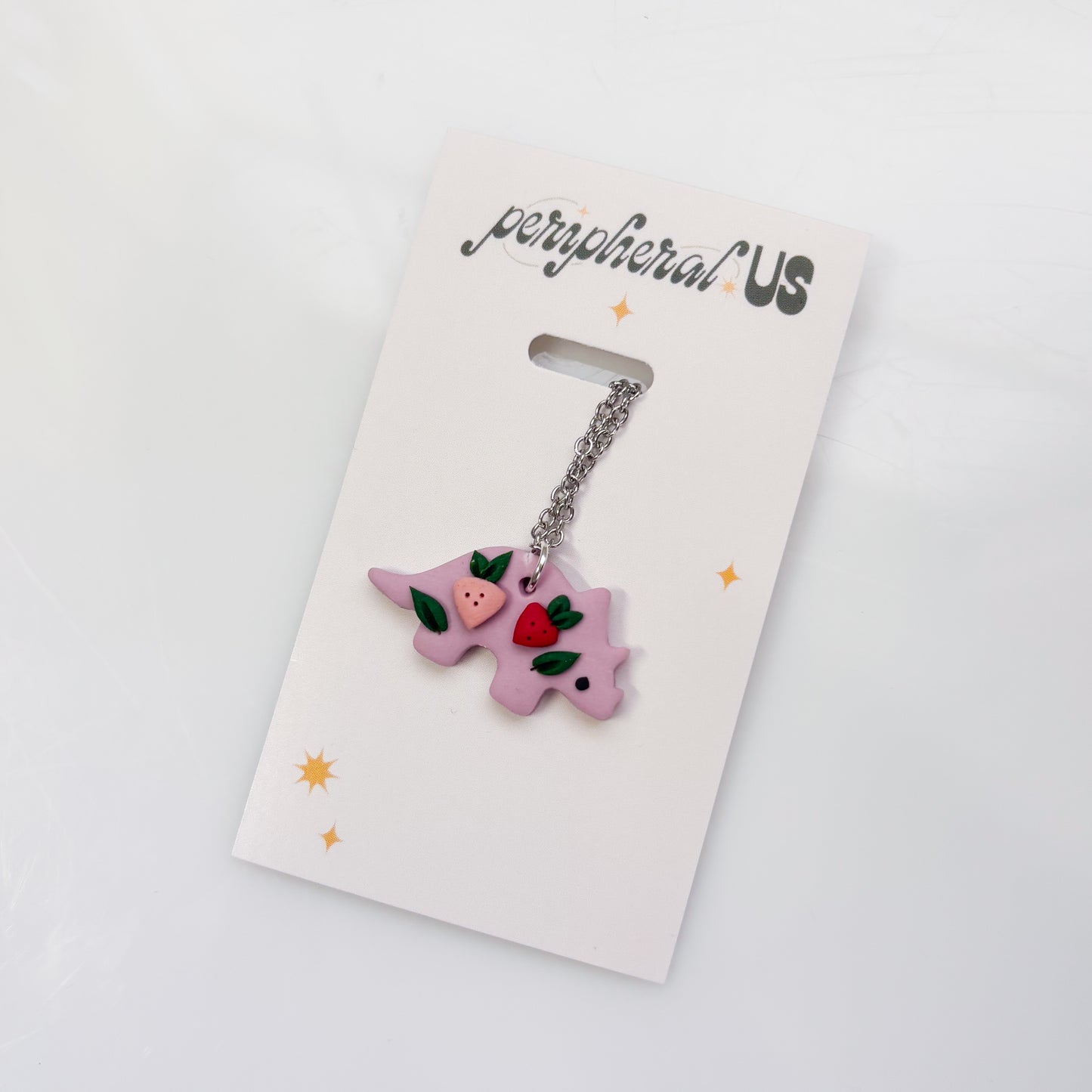 LILAC STRAWBERRY DINO NECKLACE (TRICERATOPS)