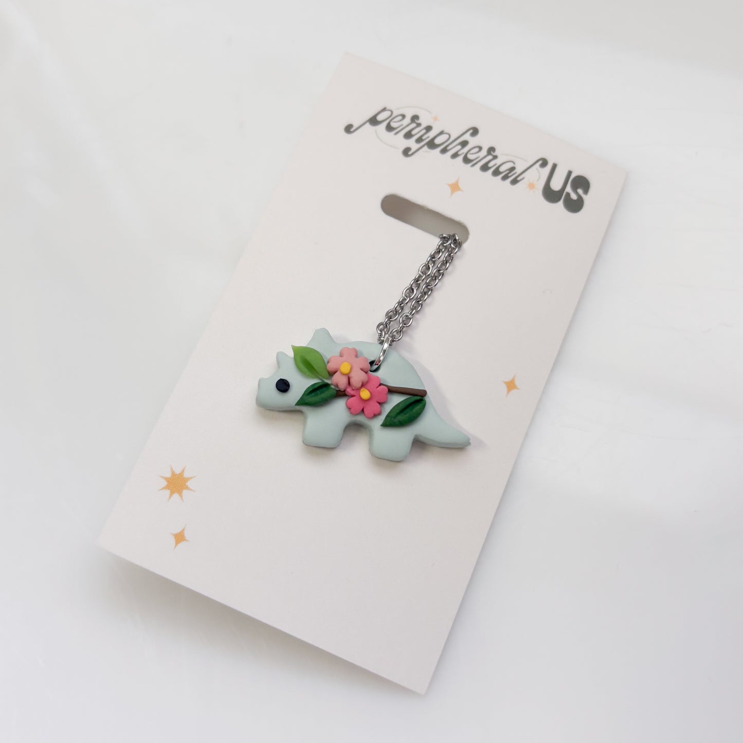 GLACIER BLUE CHERRY BLOSSOM DINO NECKLACE (TRICERATOPS)