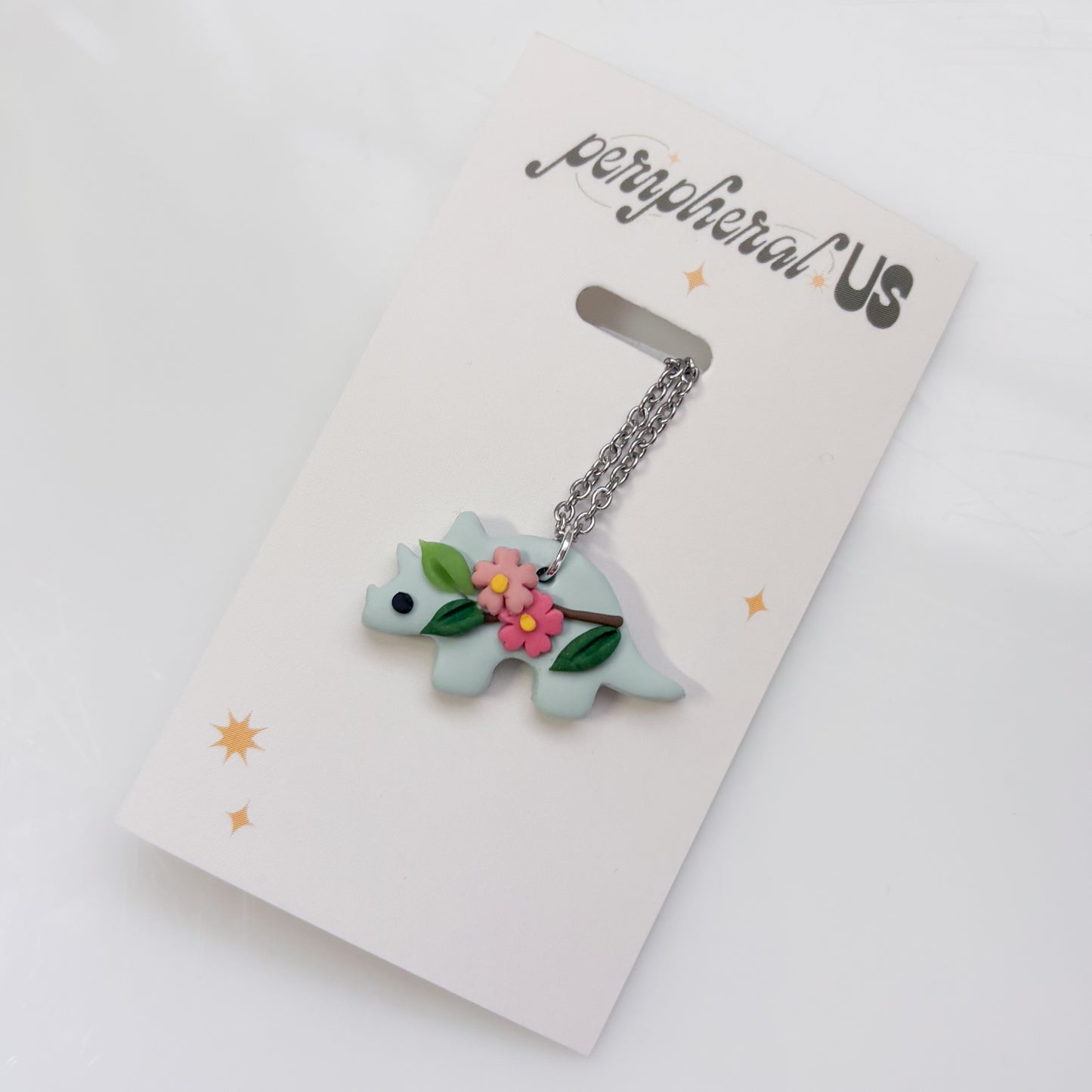 GLACIER BLUE CHERRY BLOSSOM DINO NECKLACE (TRICERATOPS)