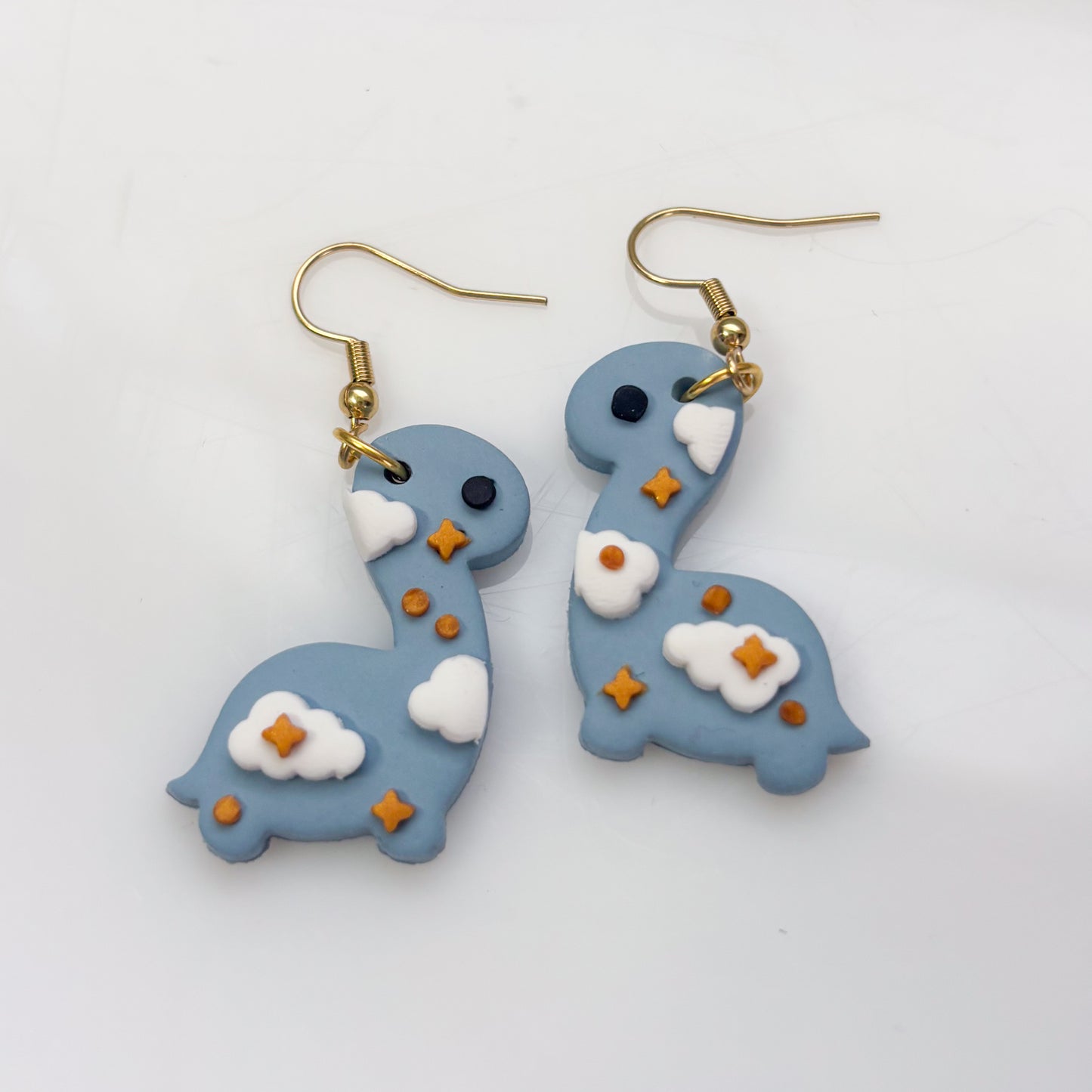 CLOUDY DINO EARRINGS (BRONTO)