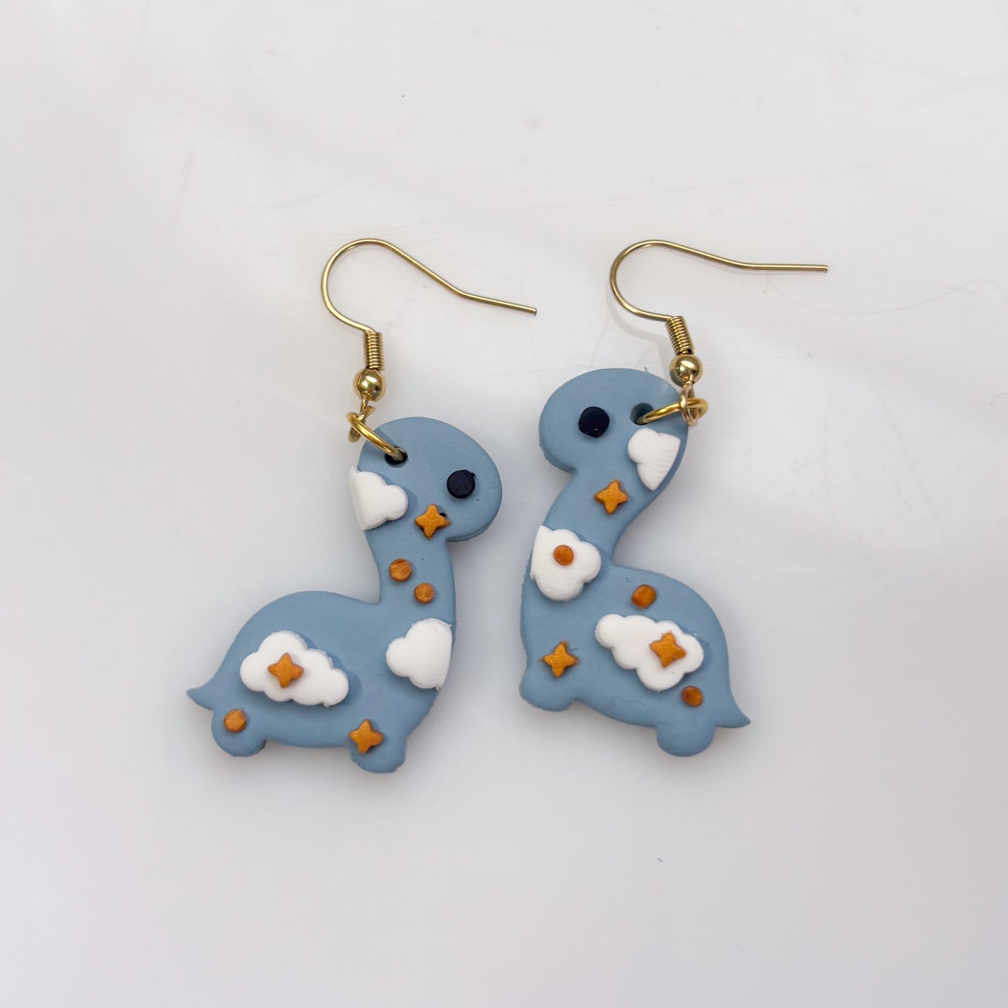 CLOUDY DINO EARRINGS (BRONTO)
