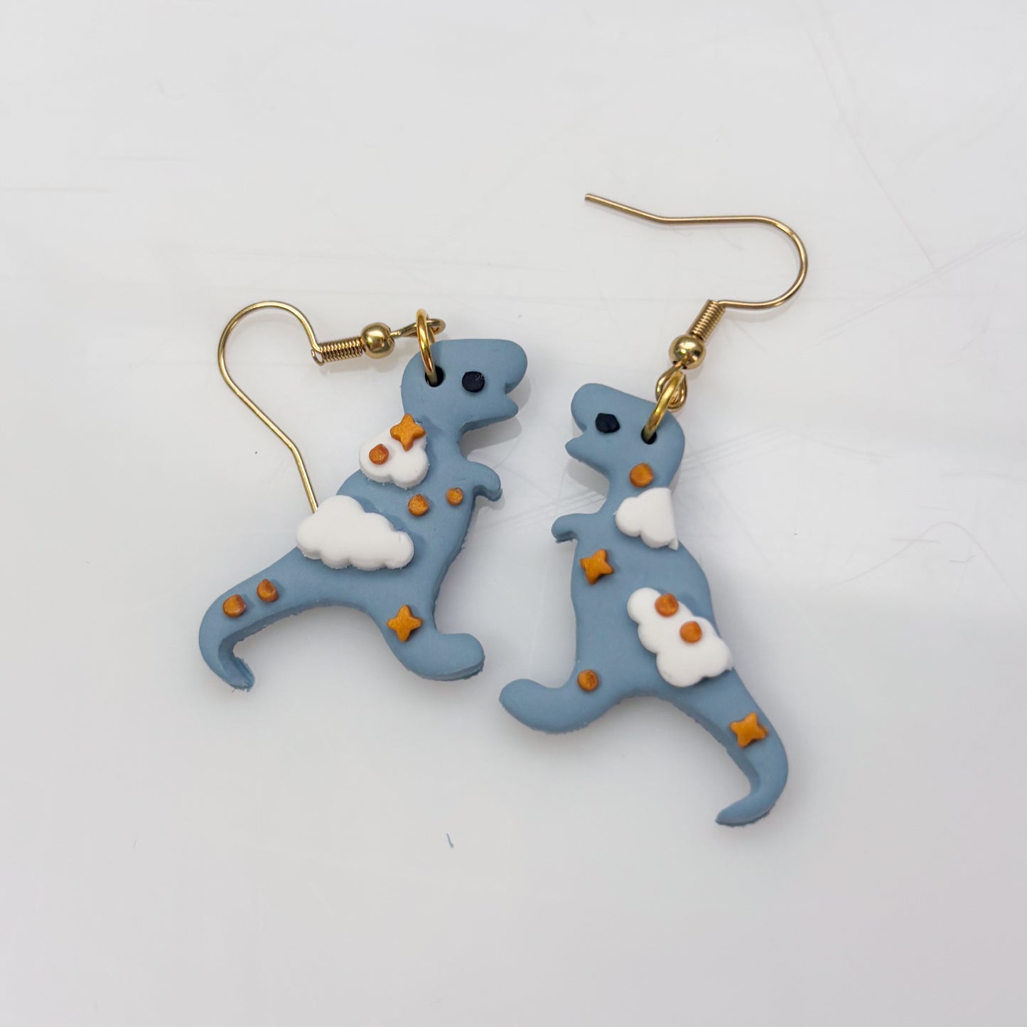 CLOUDY DINO EARRINGS (T REX)