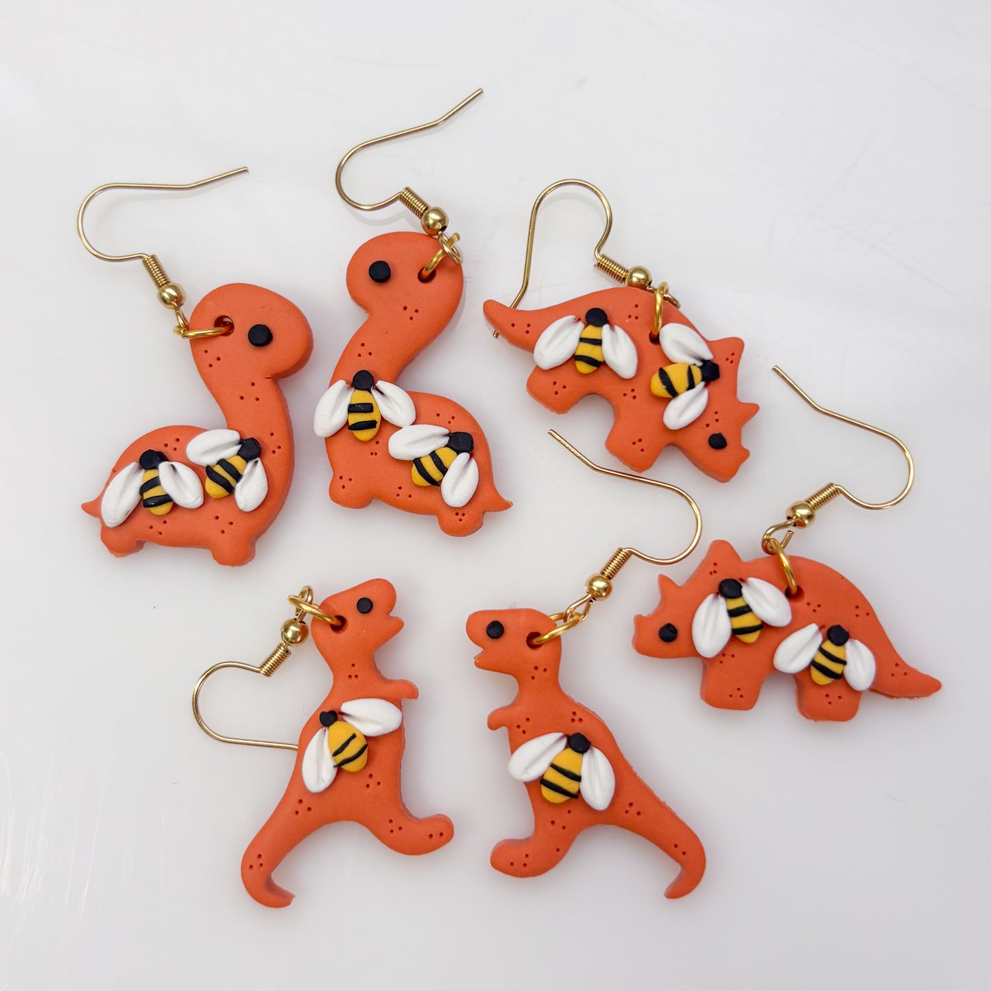 ORANGE BEE DINO EARRINGS (T REX)