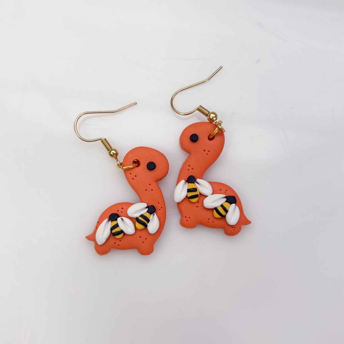 ORANGE BEE DINO EARRINGS (BRONTO)