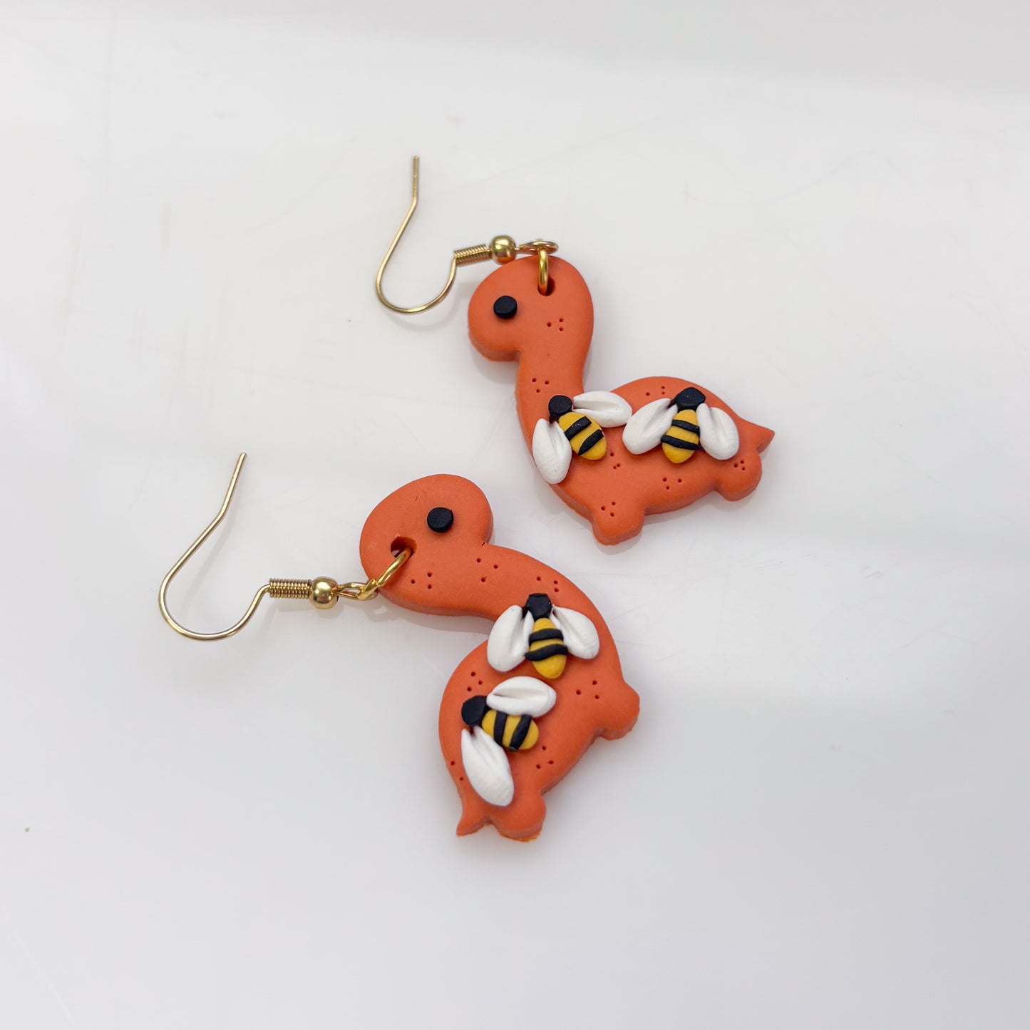 ORANGE BEE DINO EARRINGS (BRONTO)