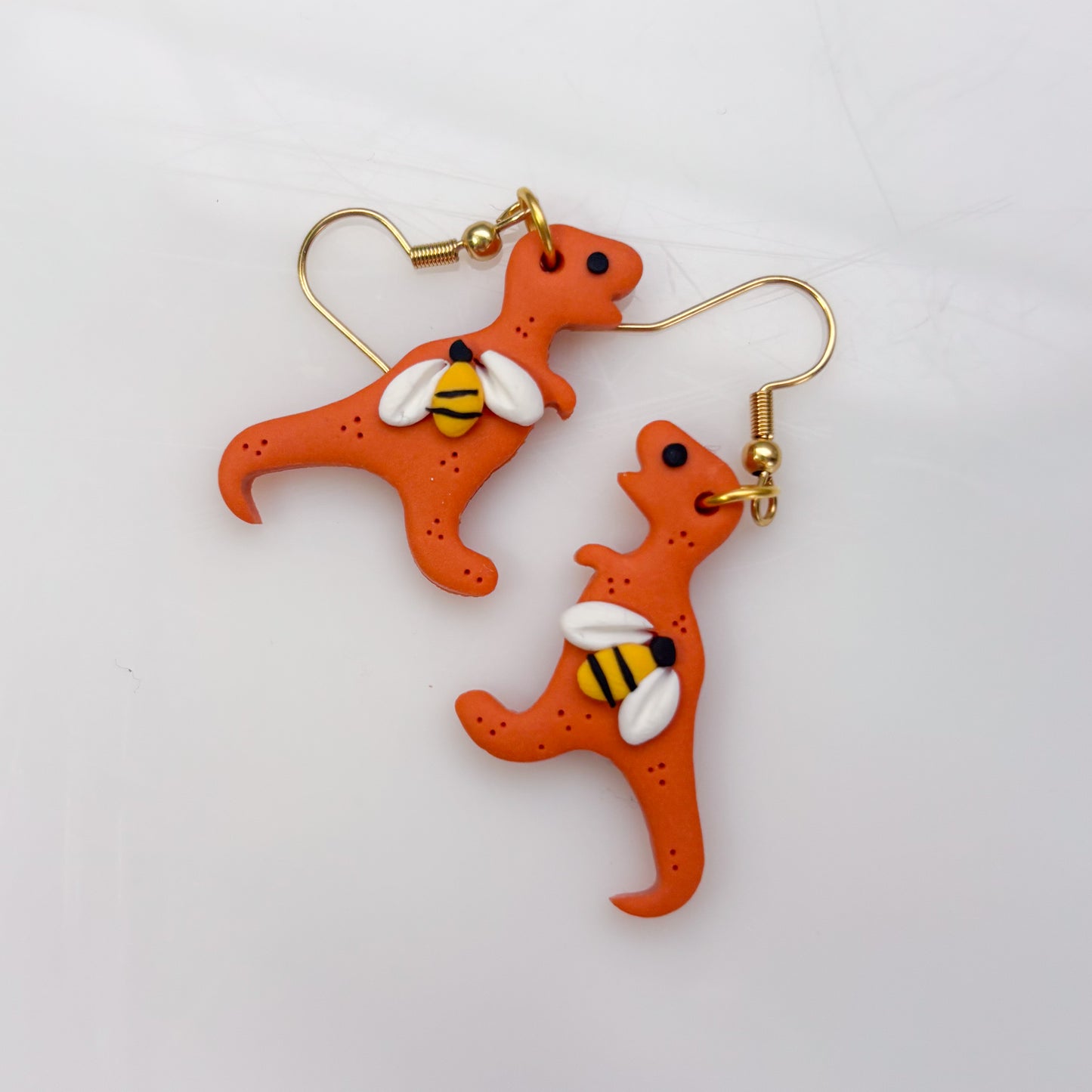 ORANGE BEE DINO EARRINGS (T REX)