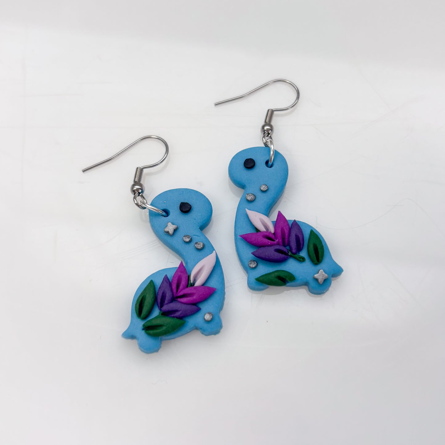 BLUE LAVENDER DINO EARRINGS (BRONTO)