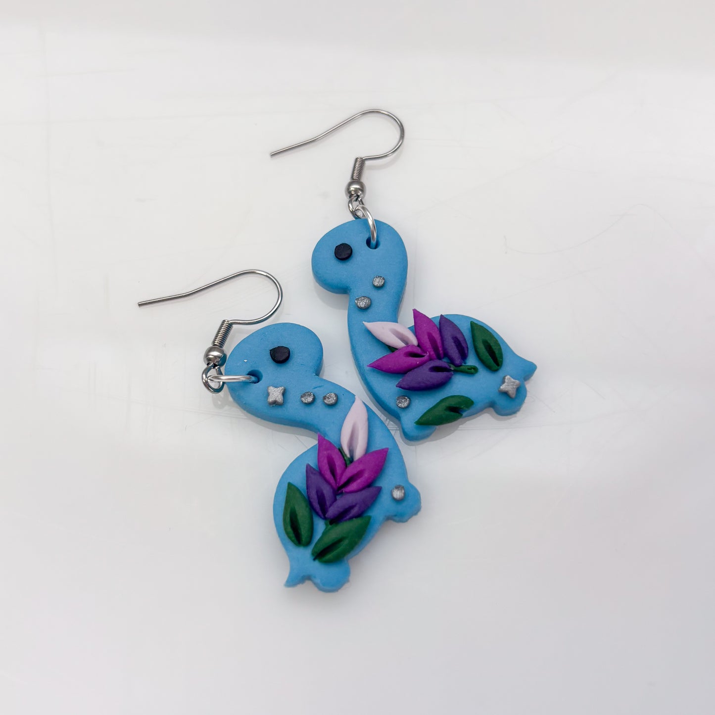 BLUE LAVENDER DINO EARRINGS (BRONTO)