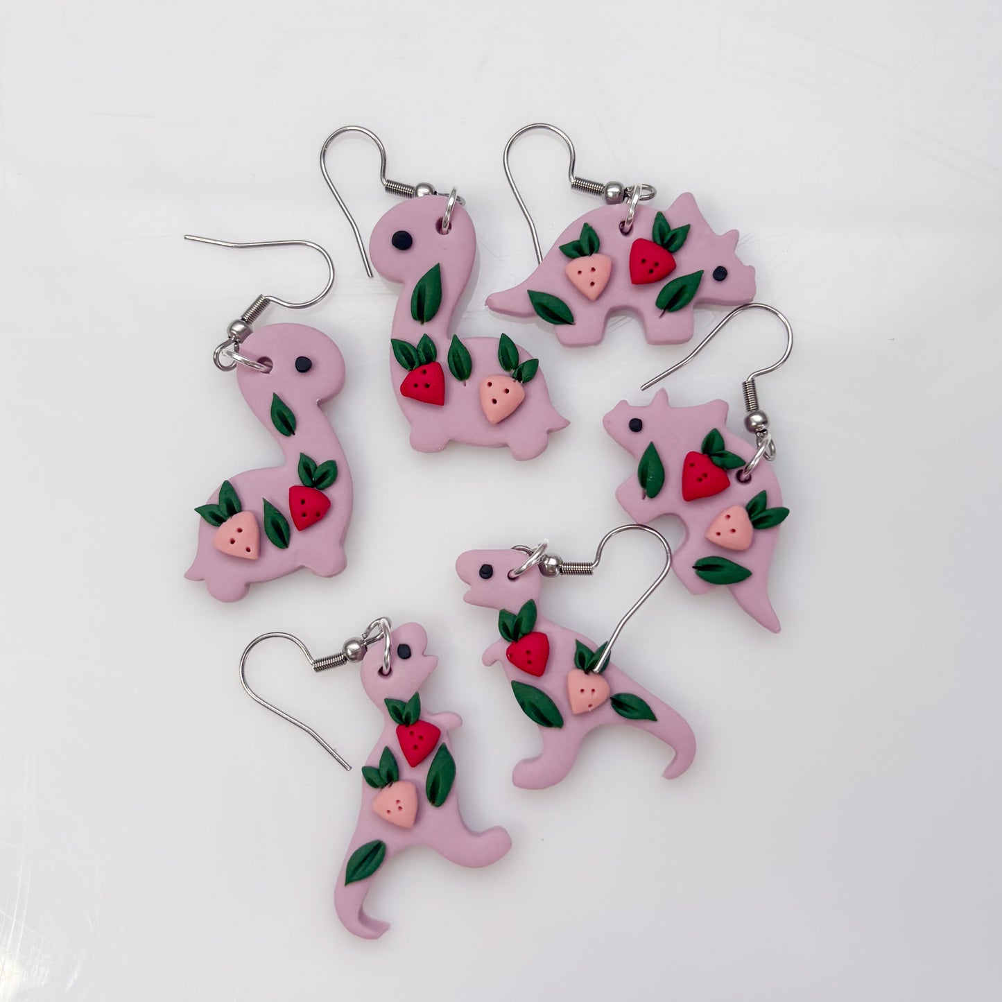 LILAC STRAWBERRY DINO EARRINGS (TRICERATOPS)