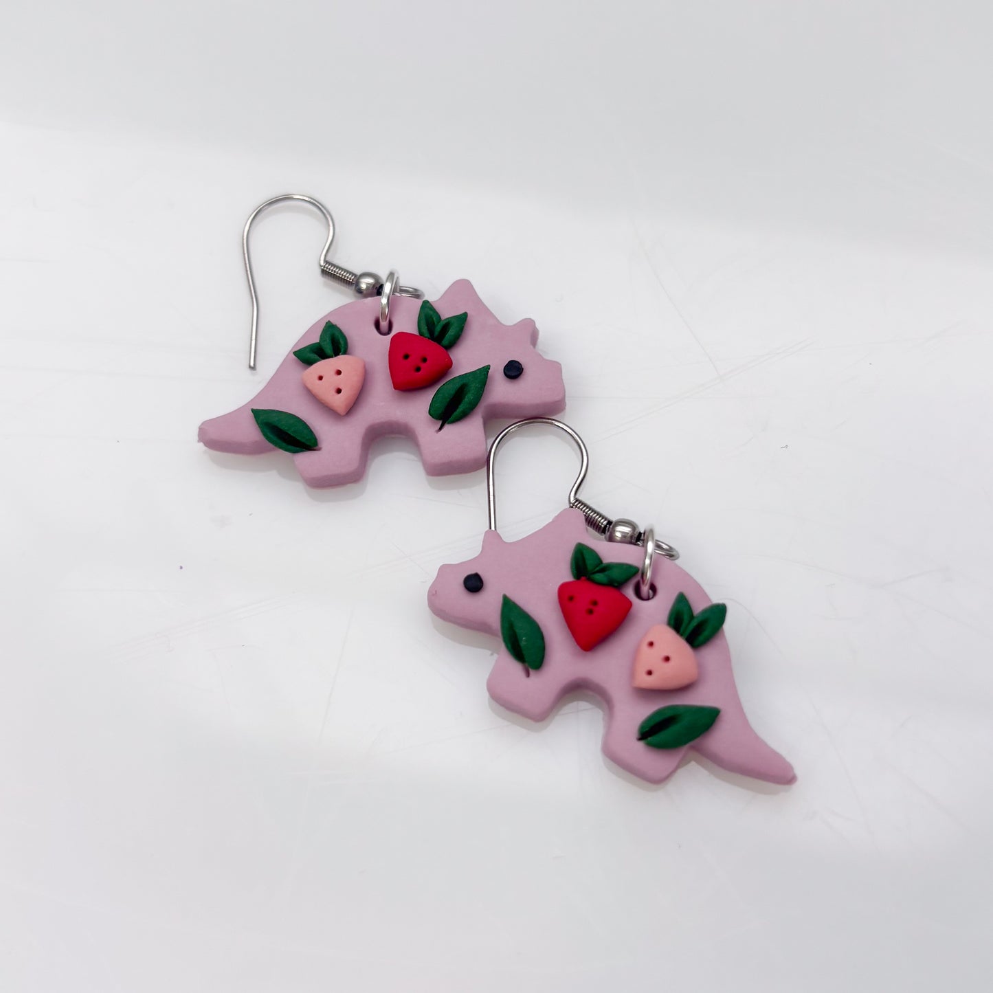 LILAC STRAWBERRY DINO EARRINGS (TRICERATOPS)