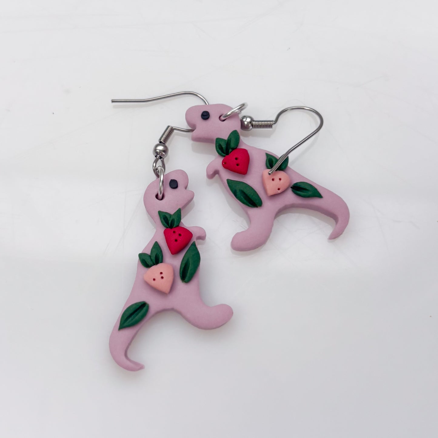 LILAC STRAWBERRY DINO EARRINGS (T REX)