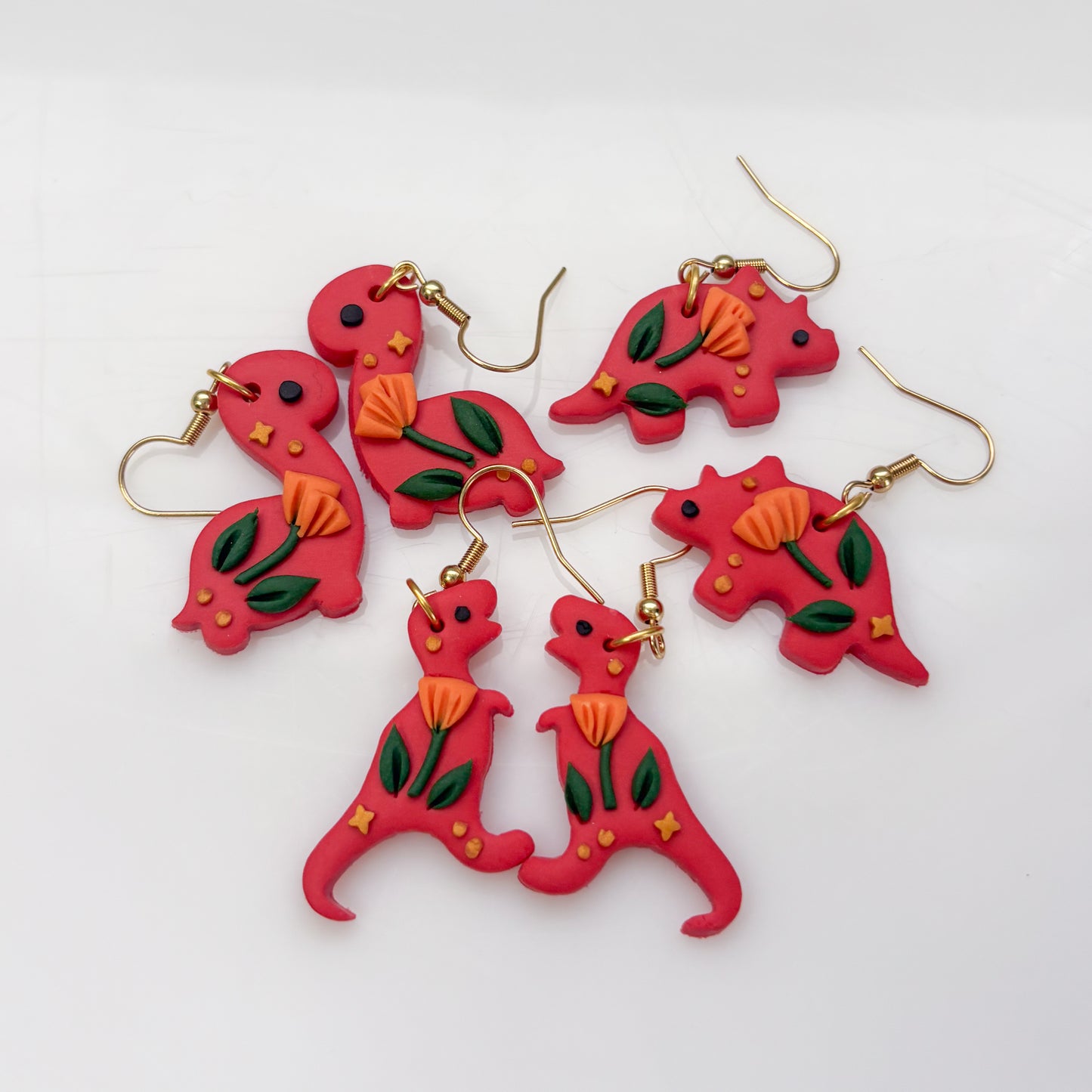 RED ORANGE POPPY DINO EARRINGS (TRICERATOPS)