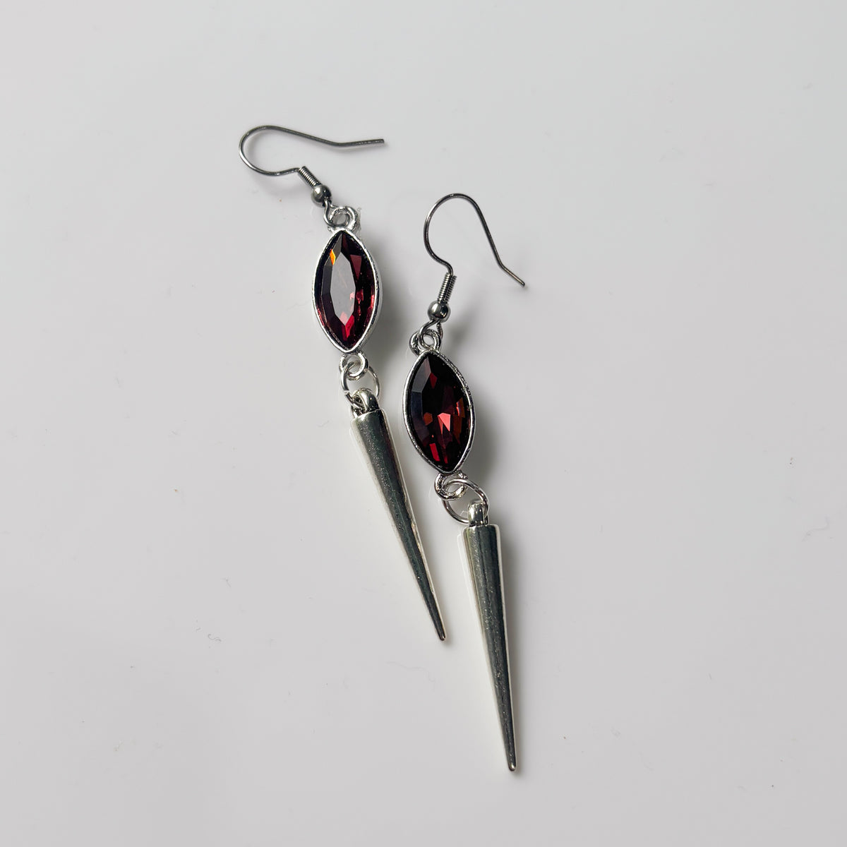 DEEP RED OVAL SILVER SPIKE CHARM EARRINGS