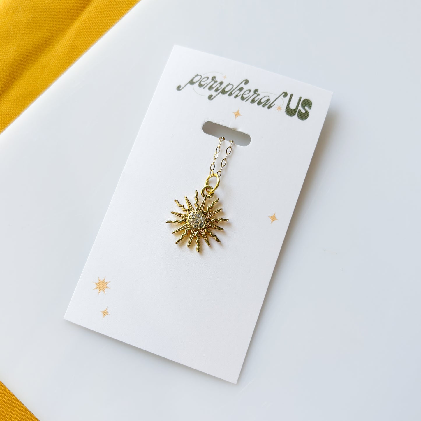 CELESTIAL SUN CHARM NECKLACE