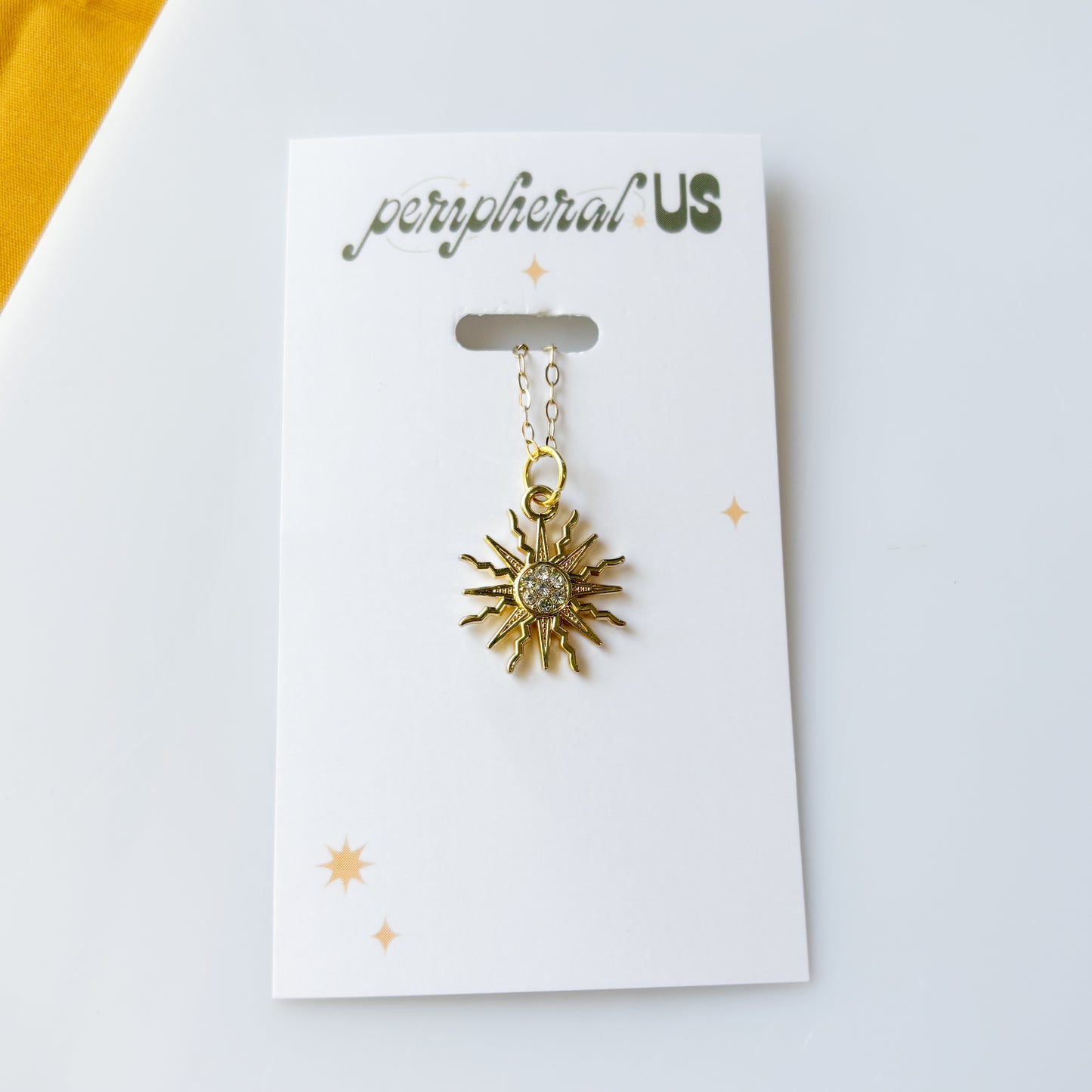 CELESTIAL SUN CHARM NECKLACE