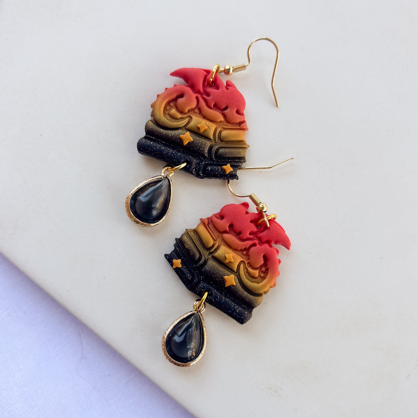 DRAGON ON BOOKS EARRINGS (RED ORANGE GOLD BLACK GLITTER)