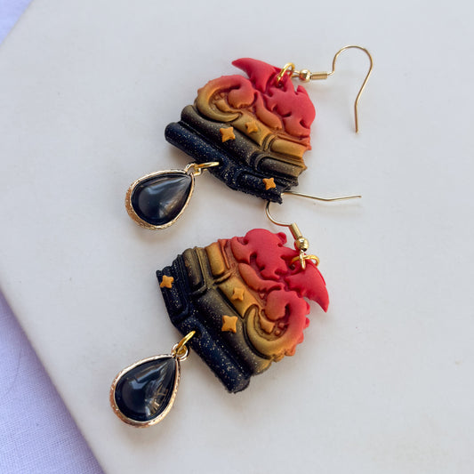 DRAGON ON BOOKS EARRINGS (RED ORANGE GOLD BLACK GLITTER)