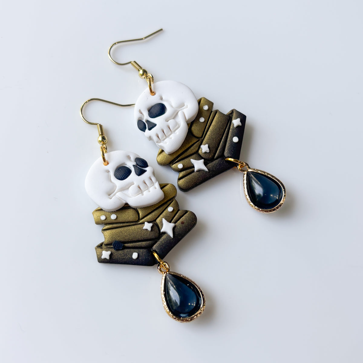 SKULLS ON BOOKS EARRINGS