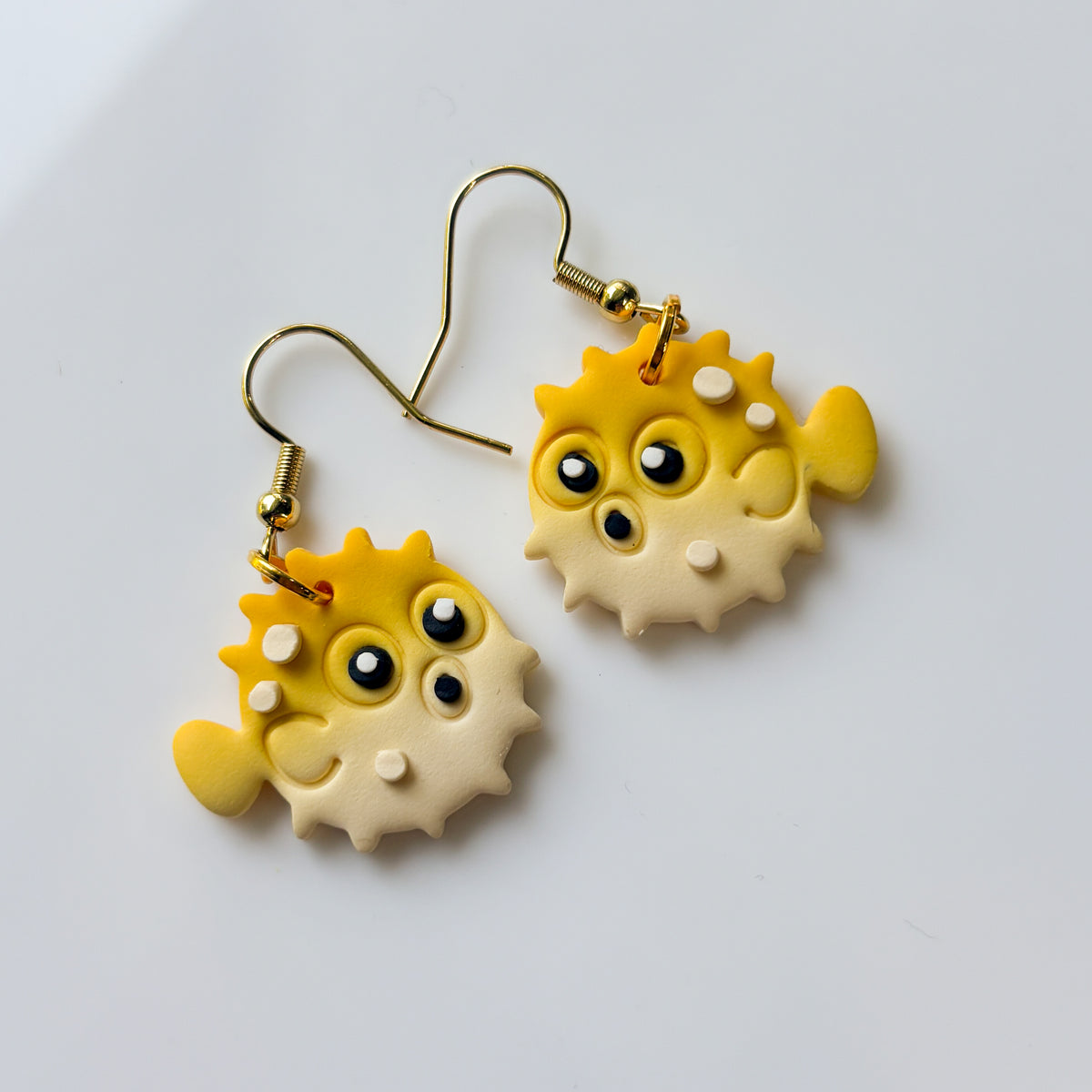 YELLOW PUFFER ANIMAL EARRINGS