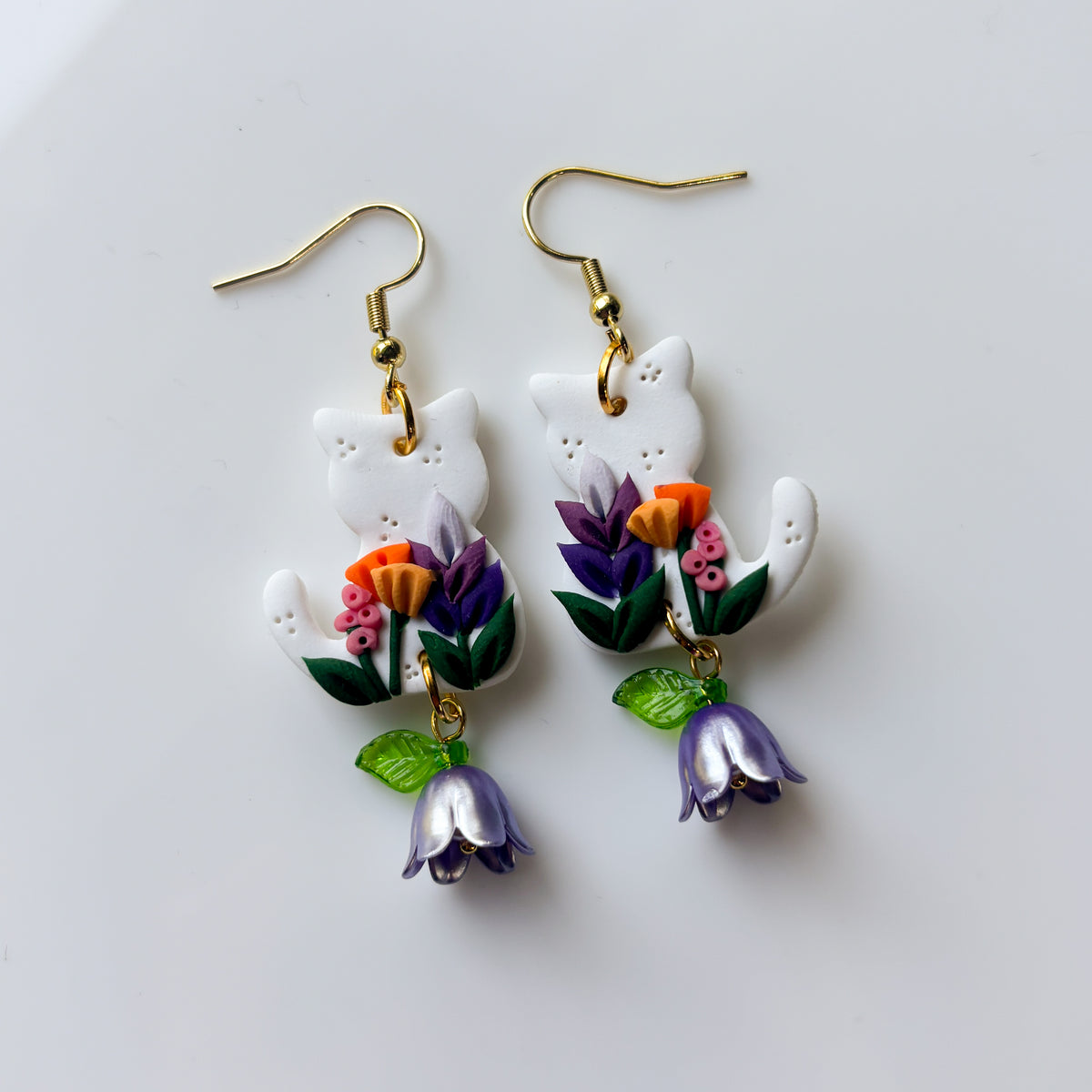 WHITE FLORAL CAT EARRINGS