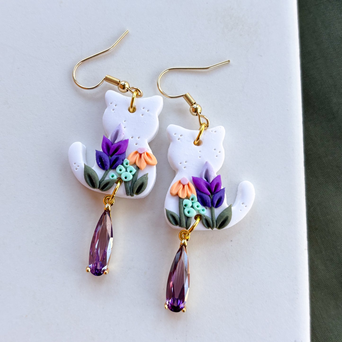 WHITE FLORAL CAT EARRINGS