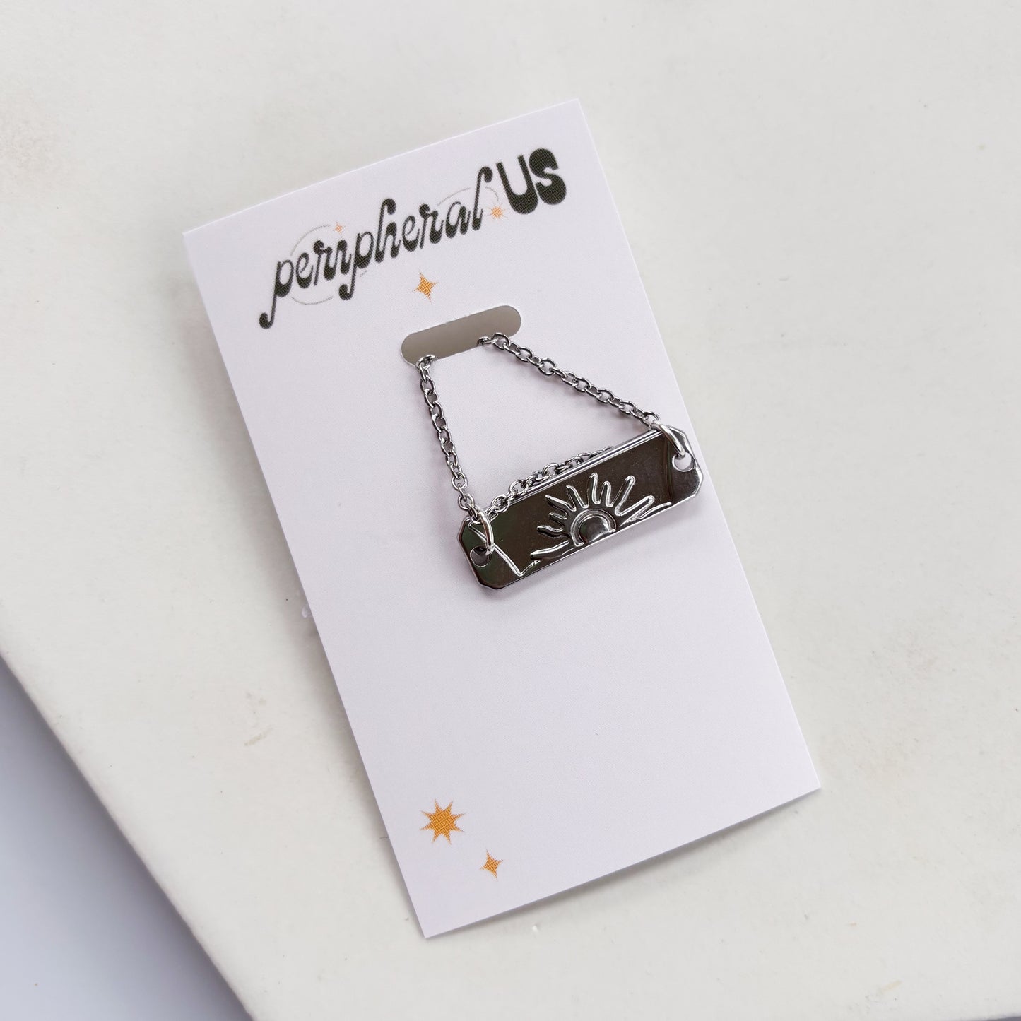 SILVER SUN CHARM NECKLACE